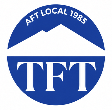 Logo with blue circle divided horizontally, with the top half containing the text 'AFT LOCAL 1985' and the bottom half displaying the initials 'TFT' in large white letters.