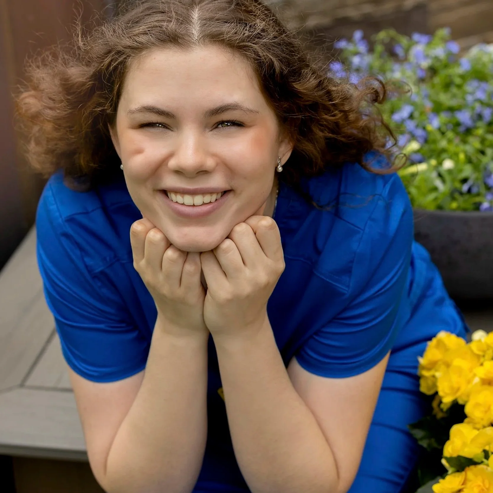 Waterloo nursing school graduate photographed in a modern senior session, celebrating her achievement with soft, natural light and joyful, confident styling