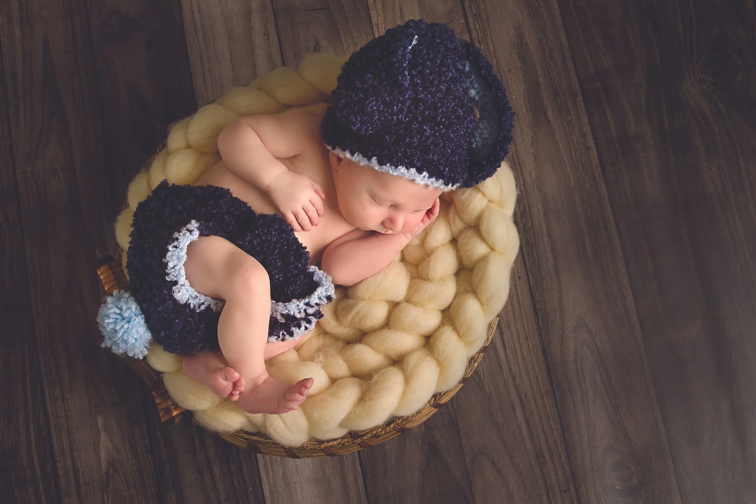 Waterloo Region newborn boy portrait — Peaceful, timeless newborn image with simple styling.