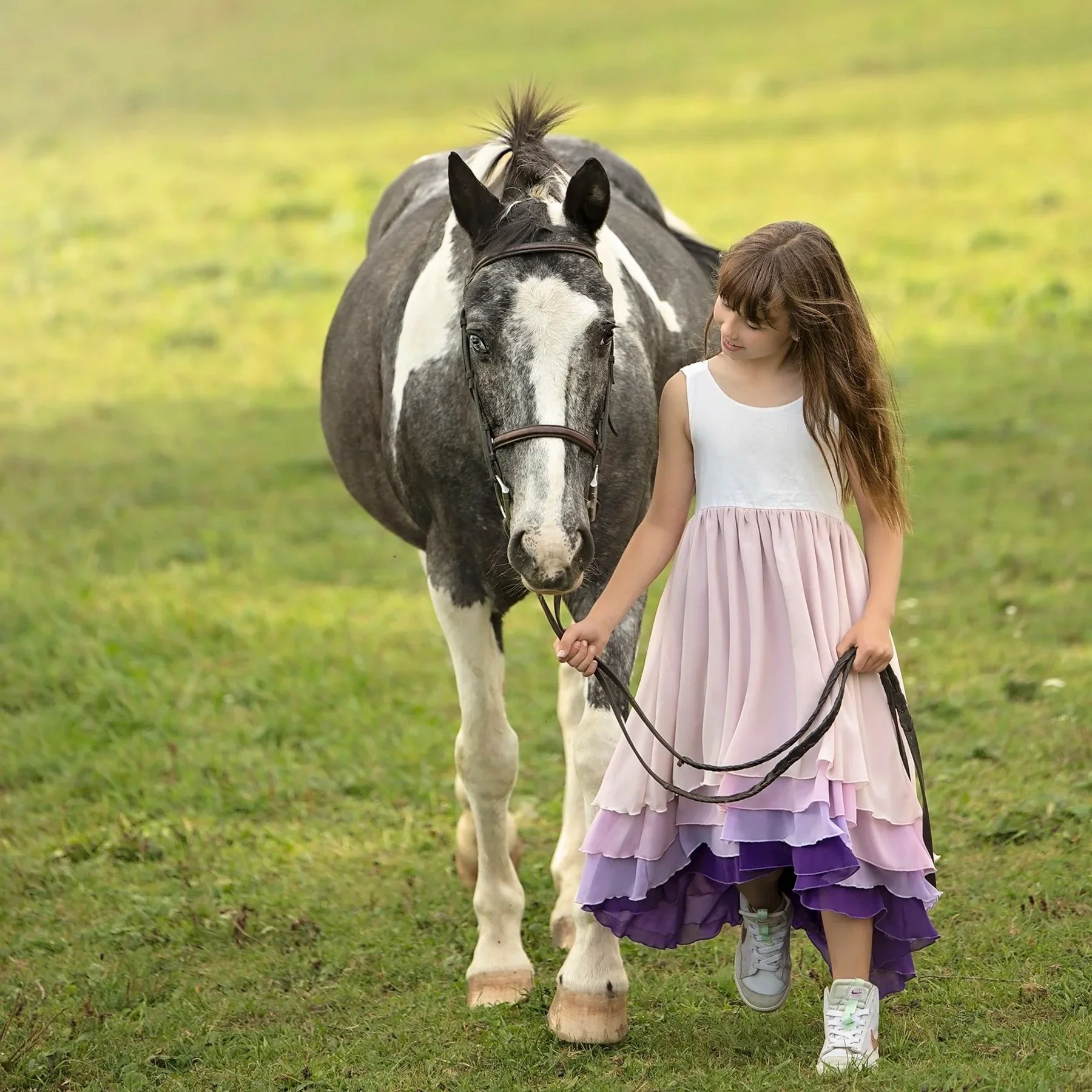 Kitchener–Waterloo equine photography of daughter and horse — Gentle, airy moment highlighting connection and calm between horse and rider.