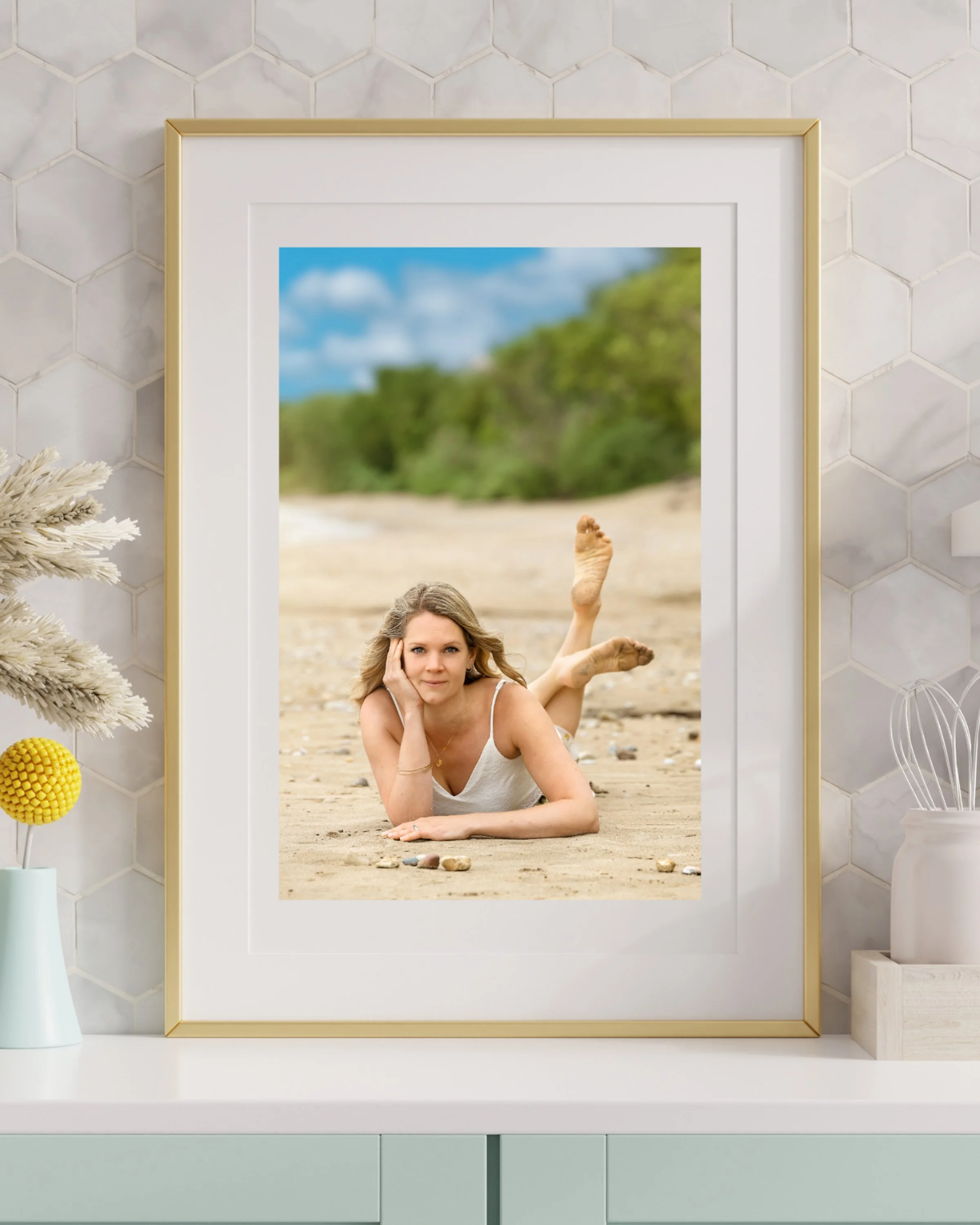 Woman laying on the beach during a female empowerment wall art photography session in Kincardine, Southern Ontario