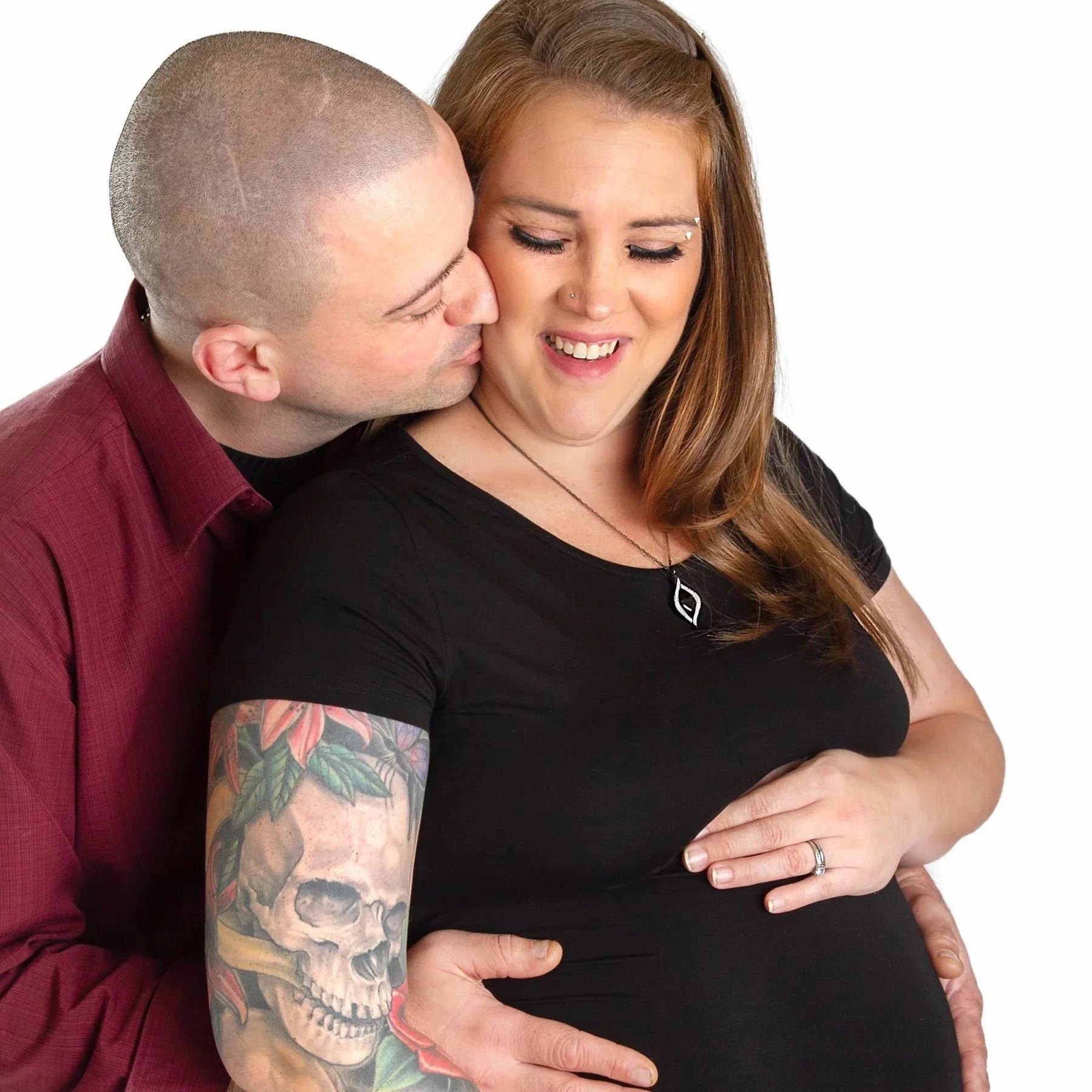 Maternity session with husband and wife in Waterloo Region — Expecting couple embracing in a soft, natural setting.