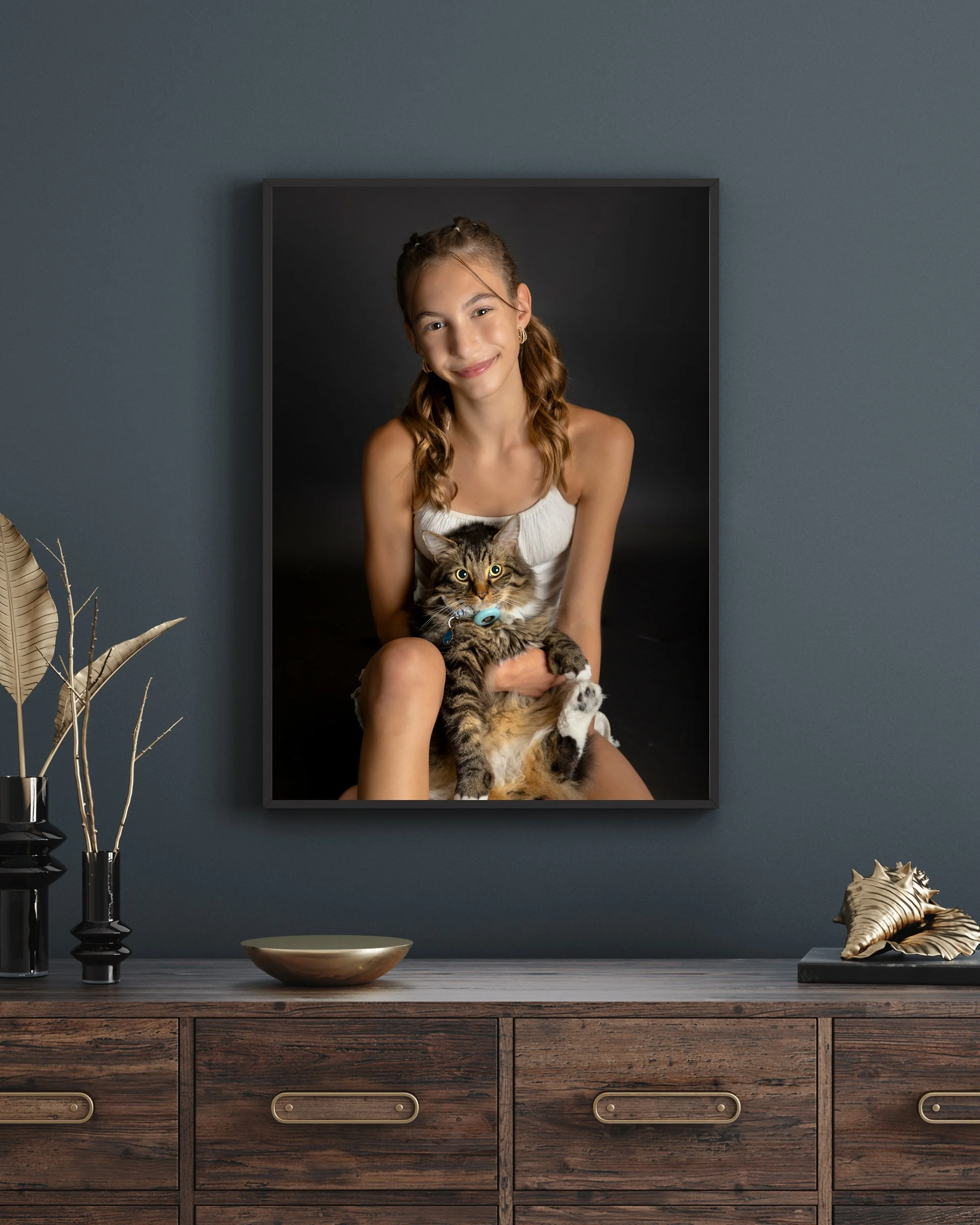 Girl holding her cat displayed as heirloom wall art by Janelle Joy Studios