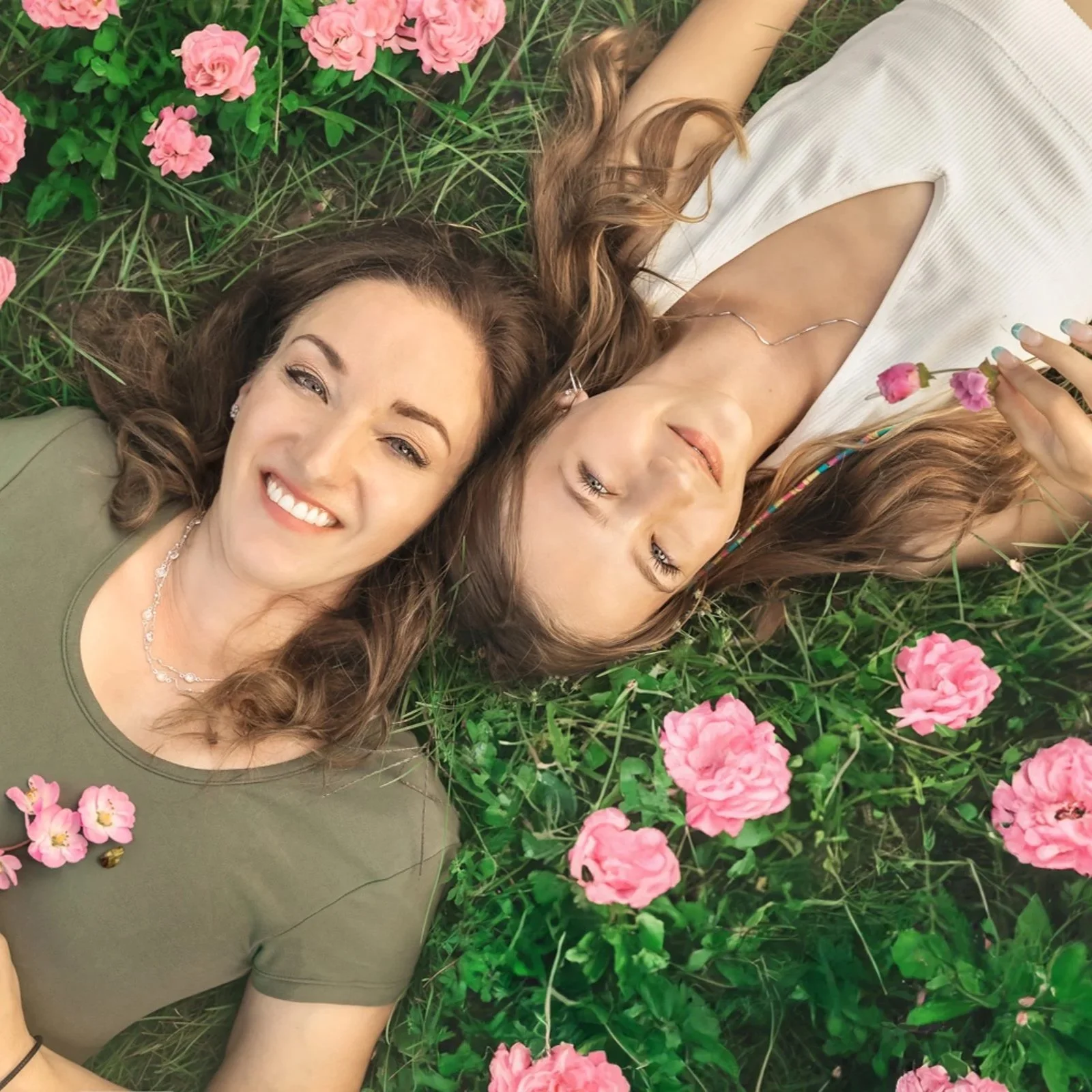Southern Ontario family photo of mom and daughter surrounded by flowers — Warm, natural image highlighting tender connection in a floral outdoor setting.