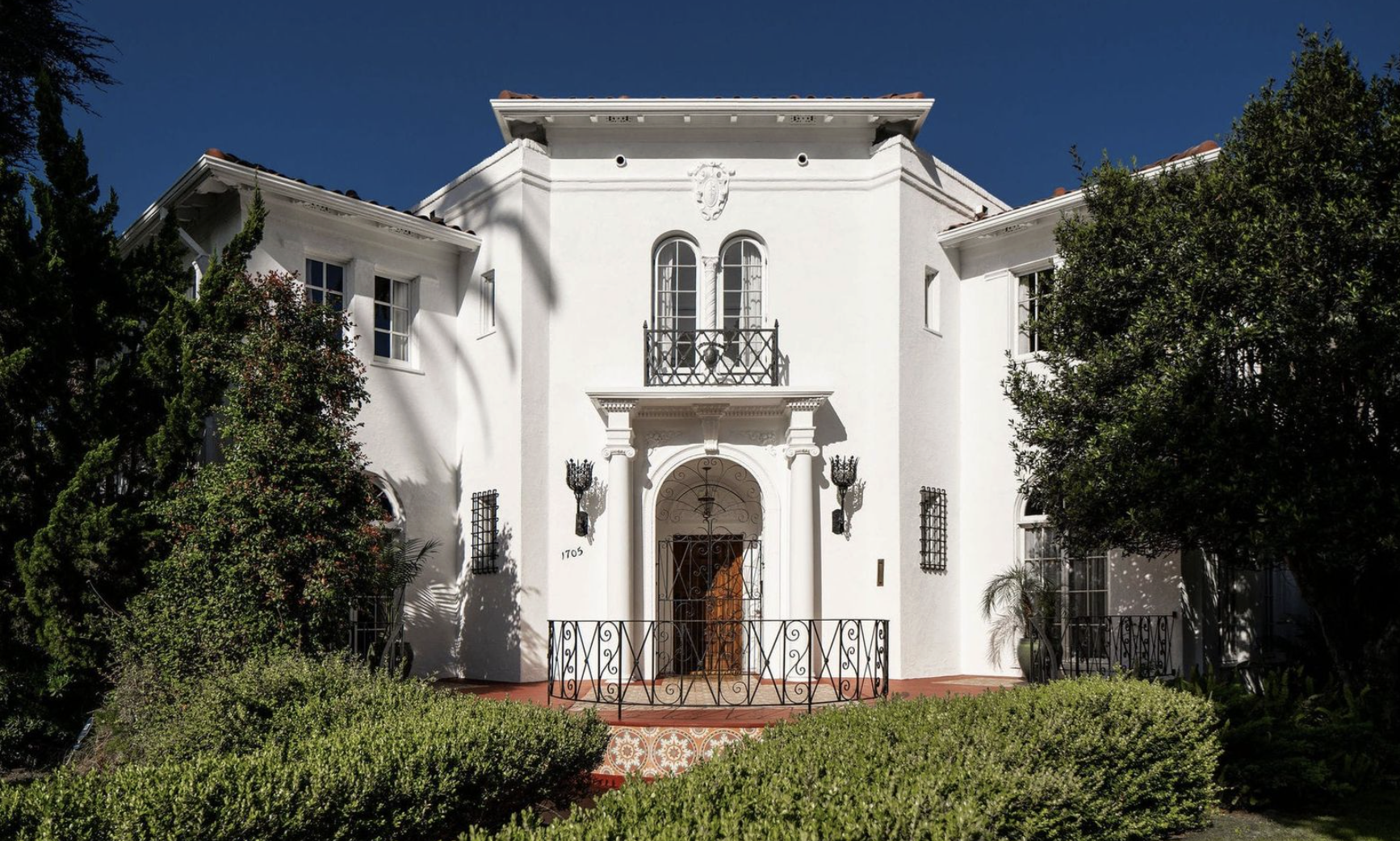 A restored 1923 Mediterranean Revival house on Wellington Road in the Lafayette Square historic district, Los Angeles