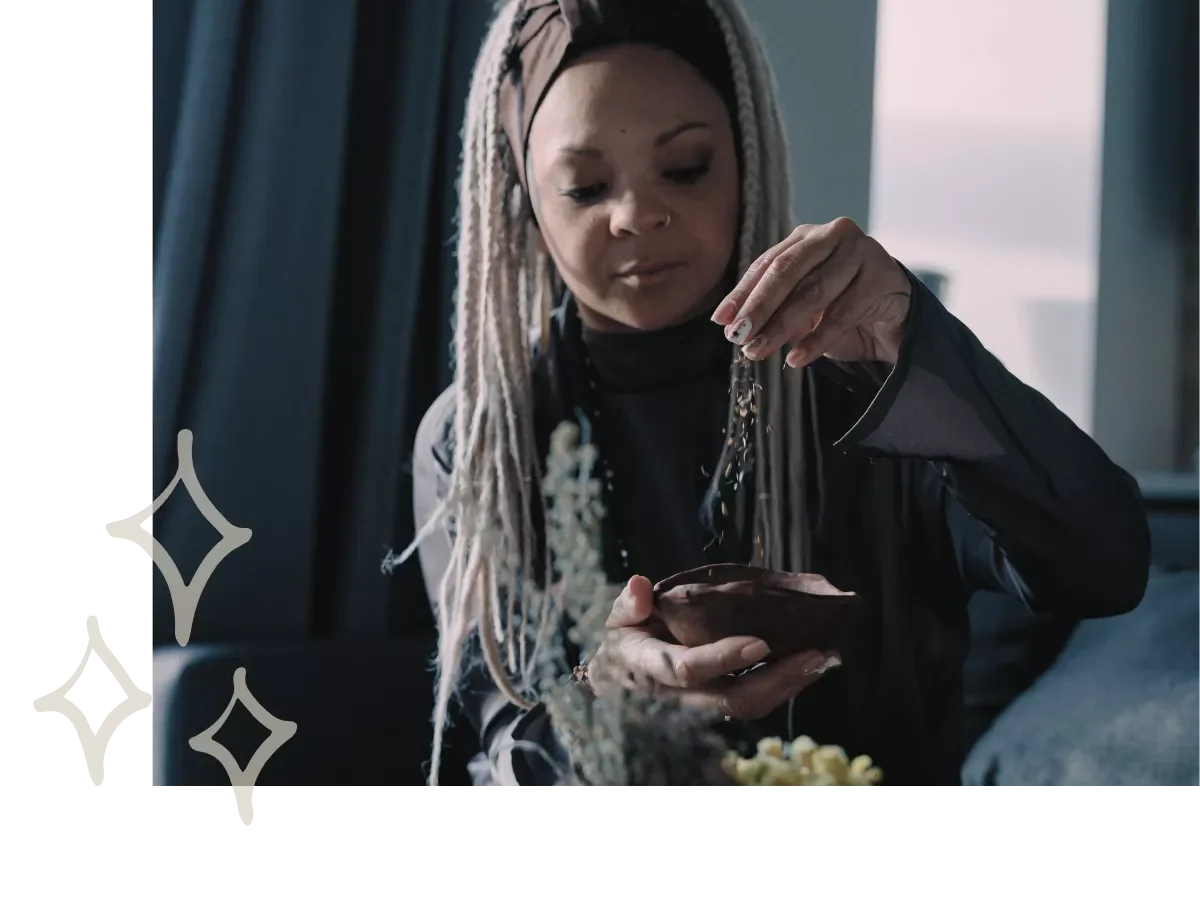A woman working with herbs.