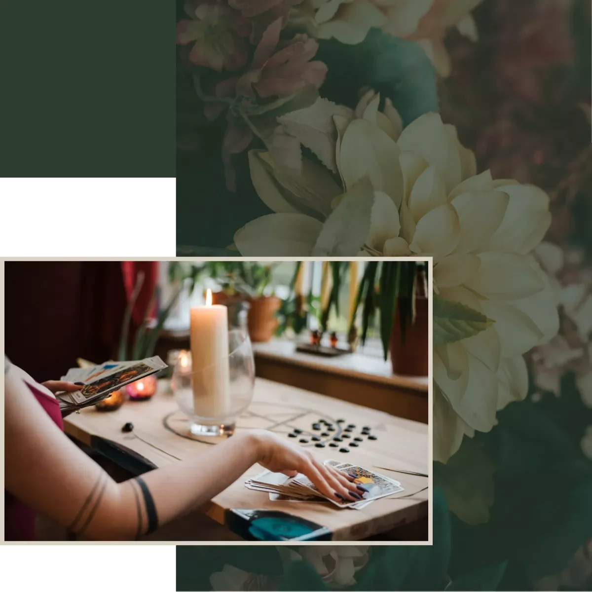 A person playing tarot cards on a wooden table with a lit candle and potted plants in the background.