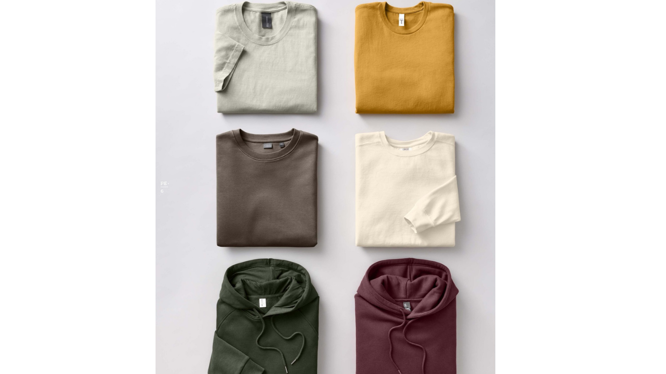 Six folded long-sleeve shirts and hoodies arranged in two columns and three rows on a white background. The top row features a beige shirt on the left and a mustard yellow shirt on the right. The middle row has a taupe shirt on the left and an ivory shirt on the right. The bottom row displays a green hoodie on the left and a maroon hoodie on the right.