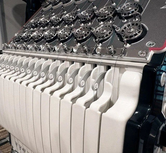 Close-up of a commercial embroidery machine.
