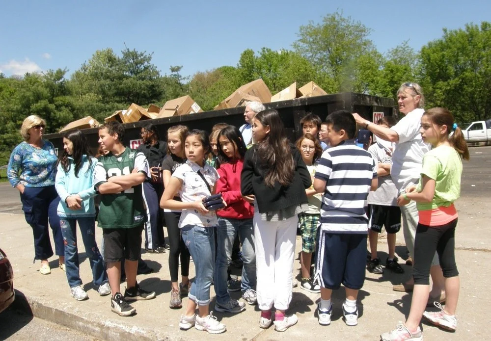 Students learning the basic rules of recycling at Holly Hill Resource Recovery Facility with Sally Davies.