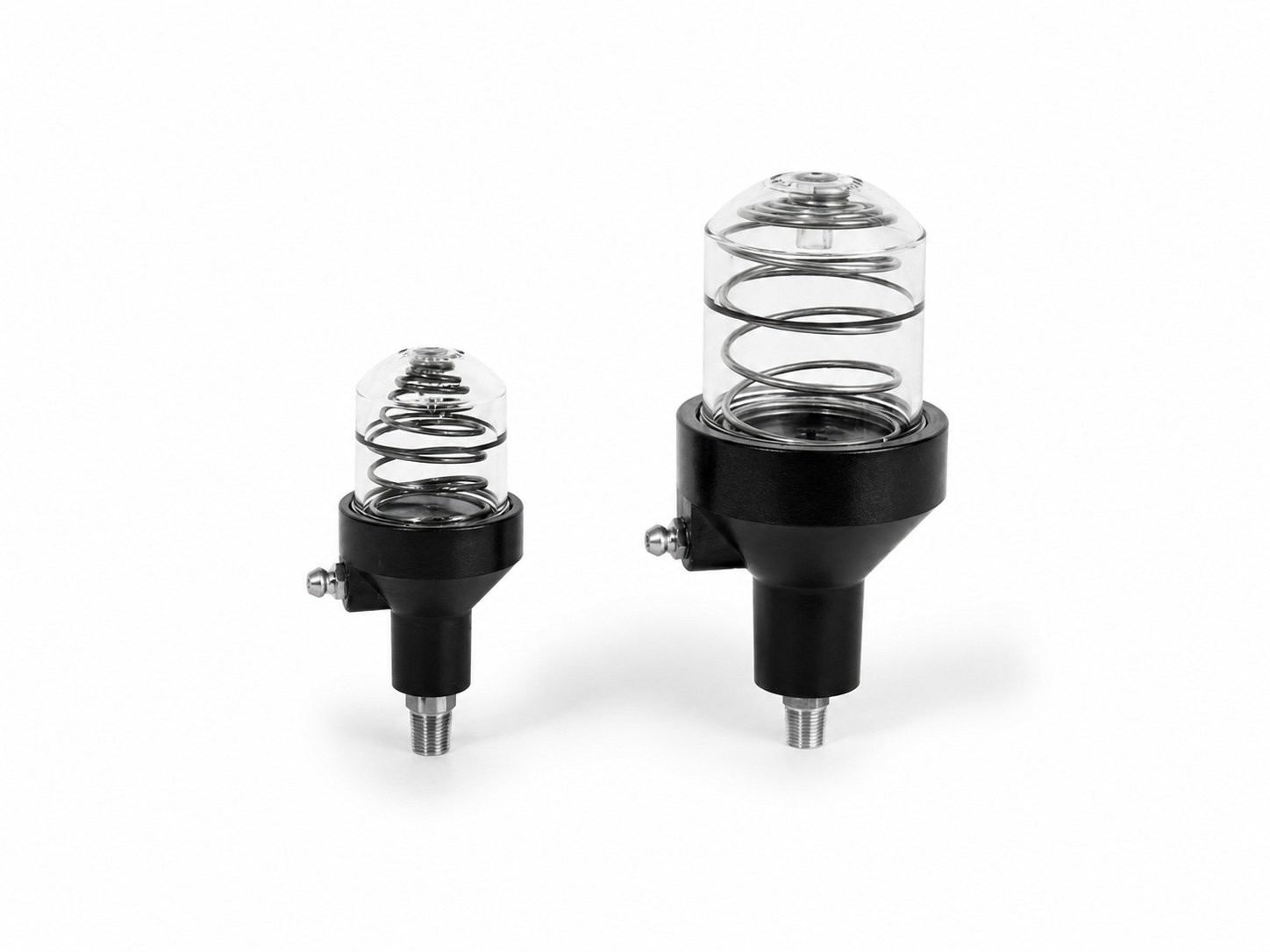 Two mechanical devices with clear cylindrical tubes containing coiled metal springs, mounted on black bases with threaded metal ends against a white background.