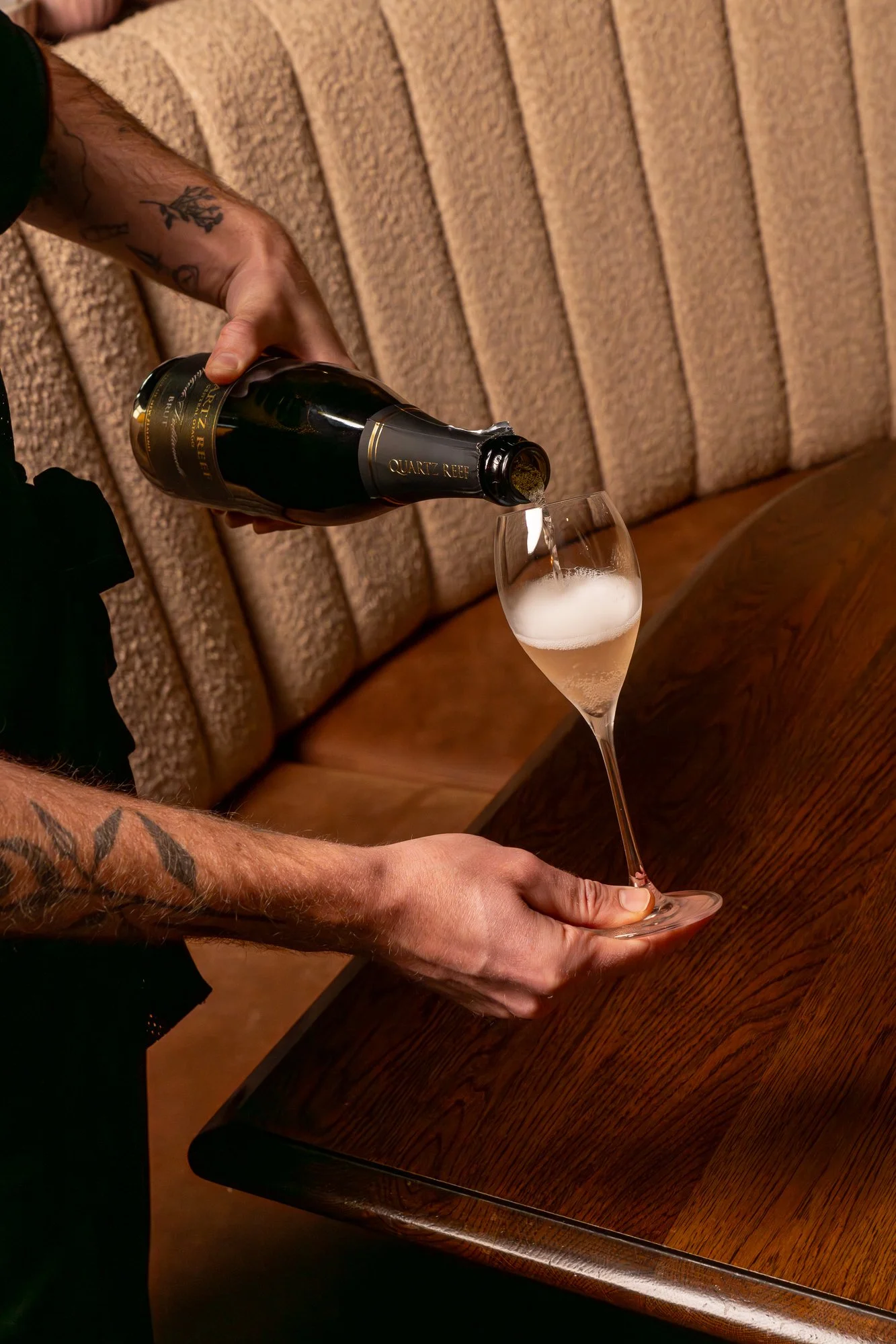 Odeon staff pouring glass of wine