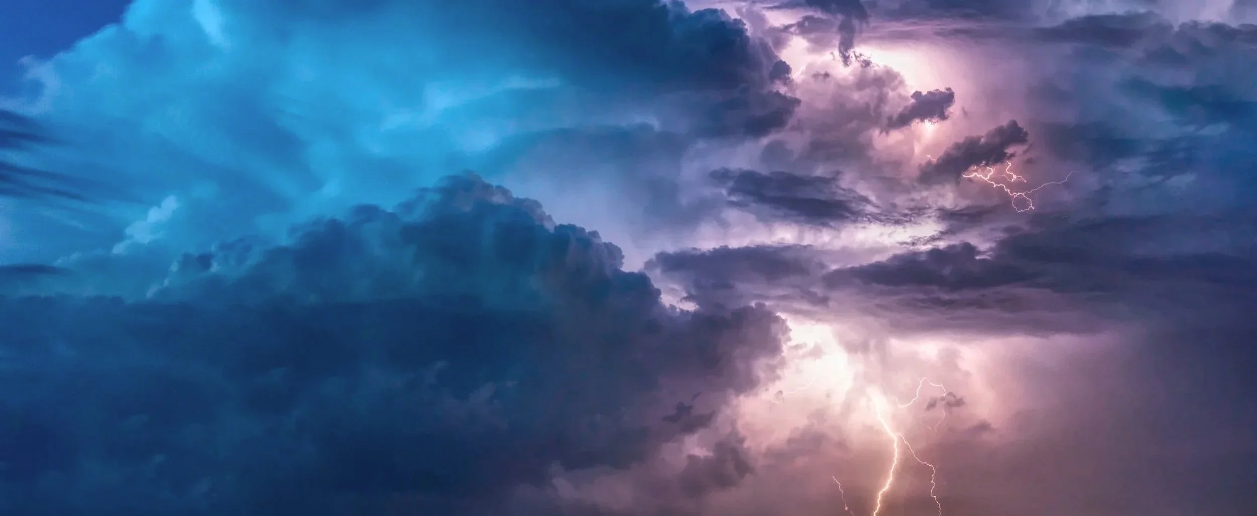 Sky filled with dark storm clouds and visible lightning strikes.