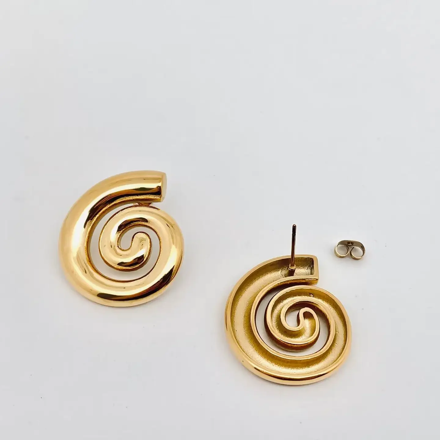 conch swirl studs 2.webp