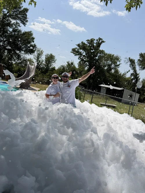 Foamageddon DFW owners standing together at a foam party