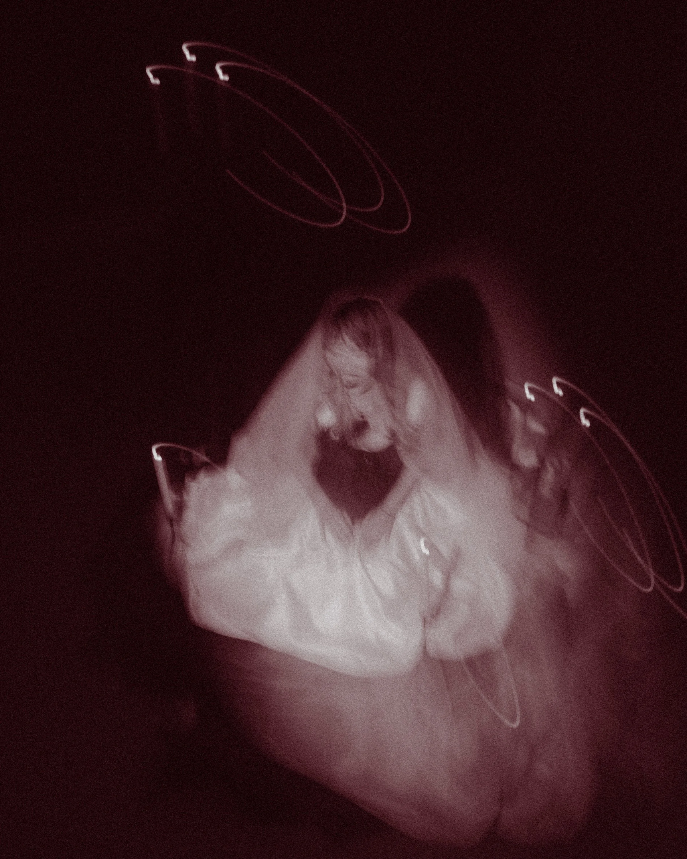 Ultrasound image of a fetus in the womb, showing facial features and an outline of the body.