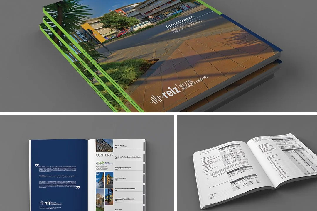 Image of a multi-stack report booklet titled 'Reiz Real Estate' with an outdoor photo of a sidewalk, trees, and buildings, and inside pages showing contents and financial data.
