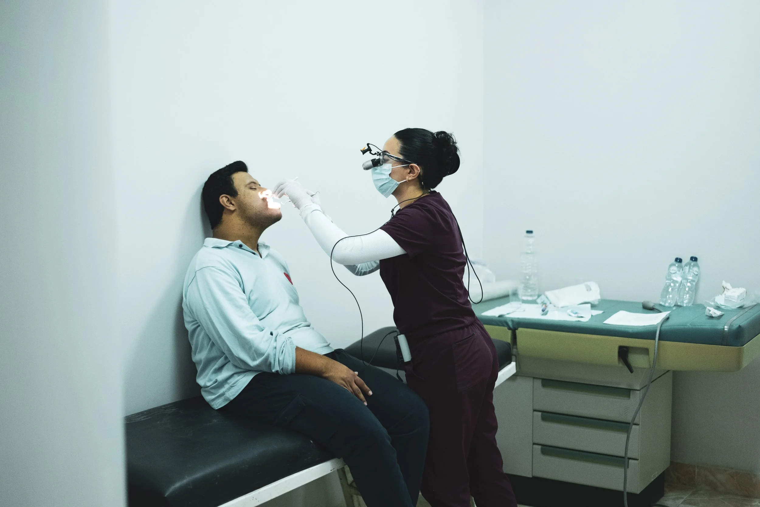 Volunteer dentist providing treatment to a patient during a CMANA medical mission in Egypt.