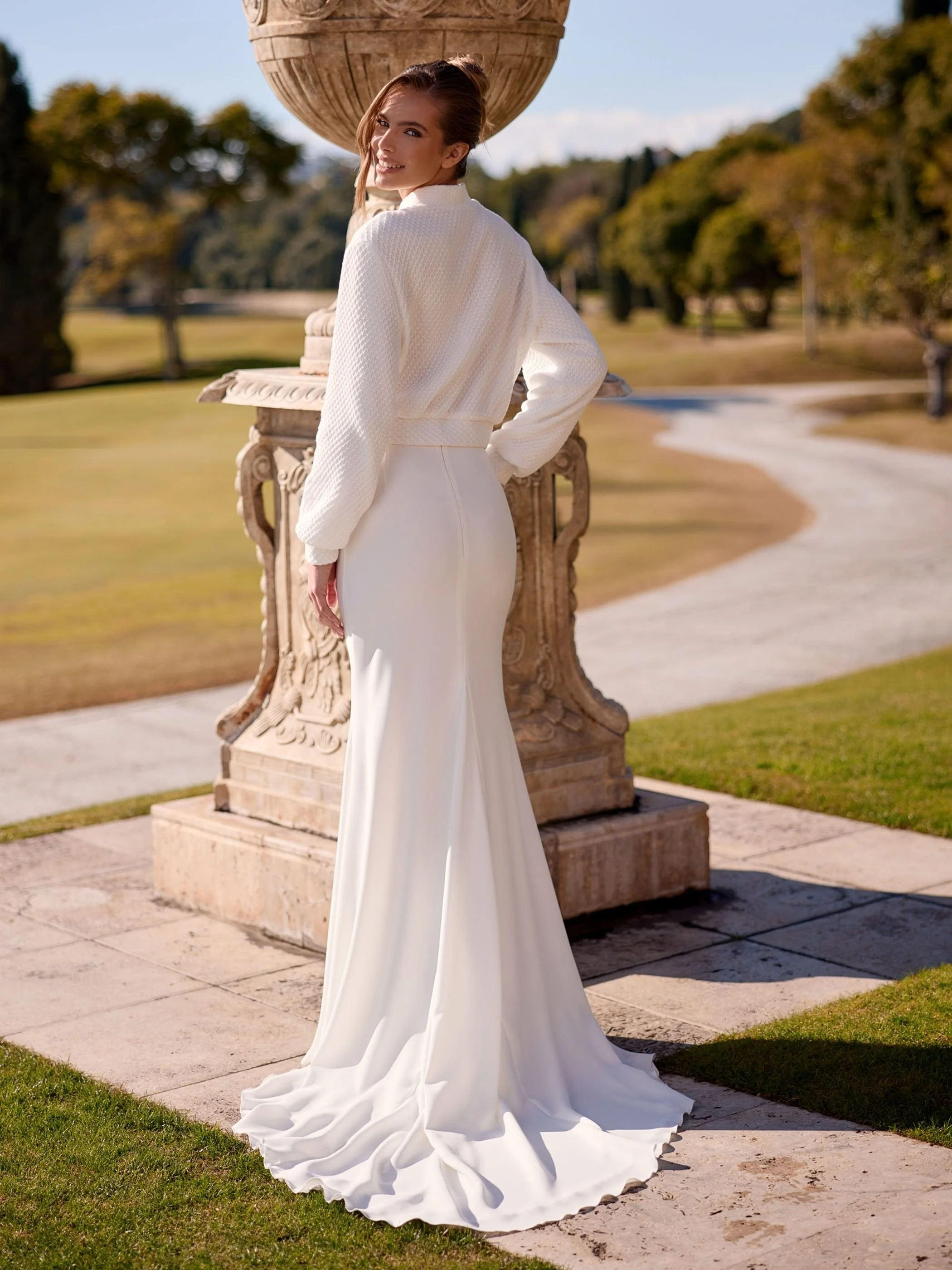 summit with bomber back view  Discover the Summit Bridal Skirt, a luxurious stretch crepe mermaid wedding skirt featuring a flattering silhouette and elegant cathedral-length train.