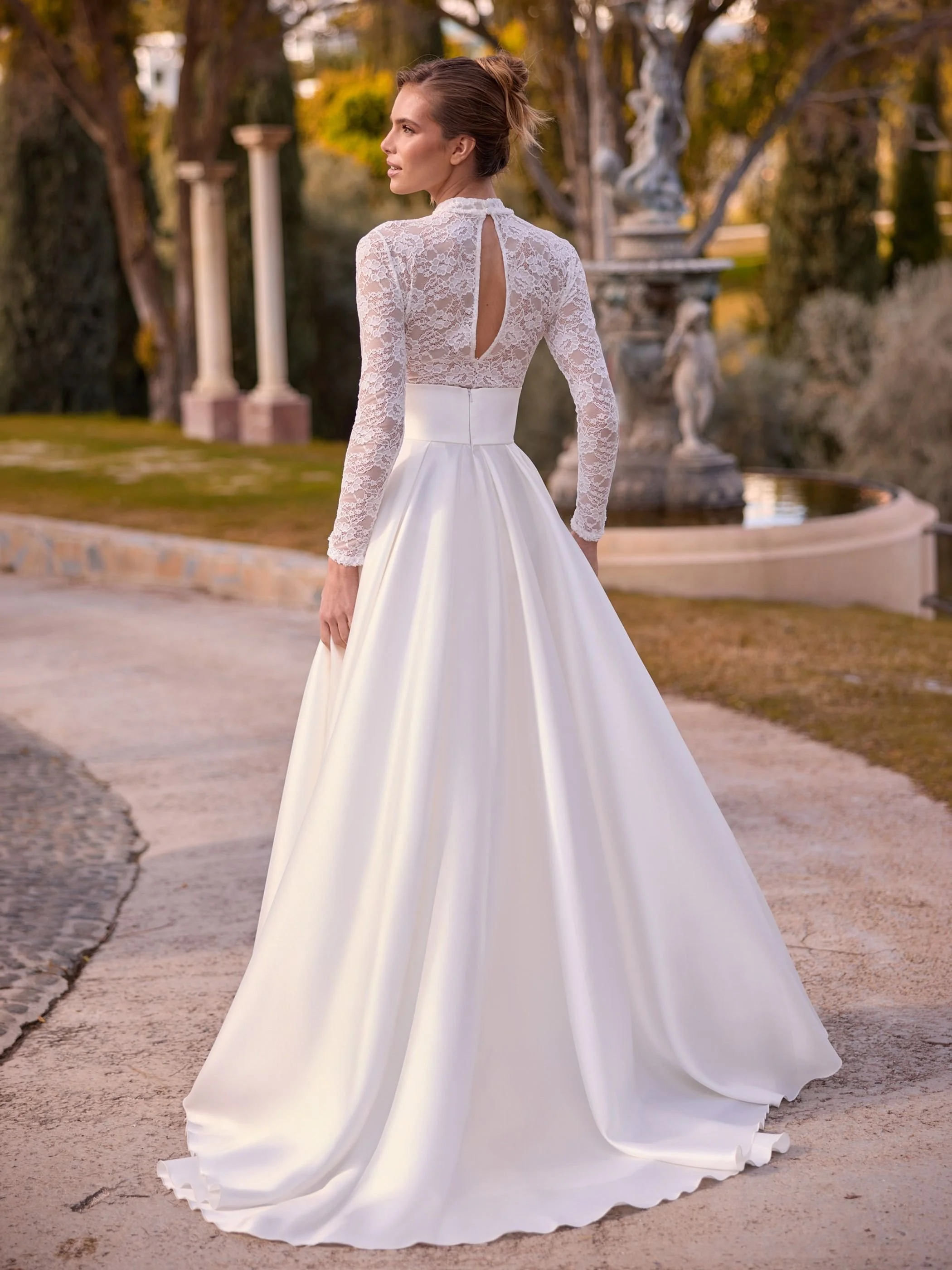 Frame skirt back.Image shows box pleat mikado bridal skirt (Damira by /Bianco evento)
