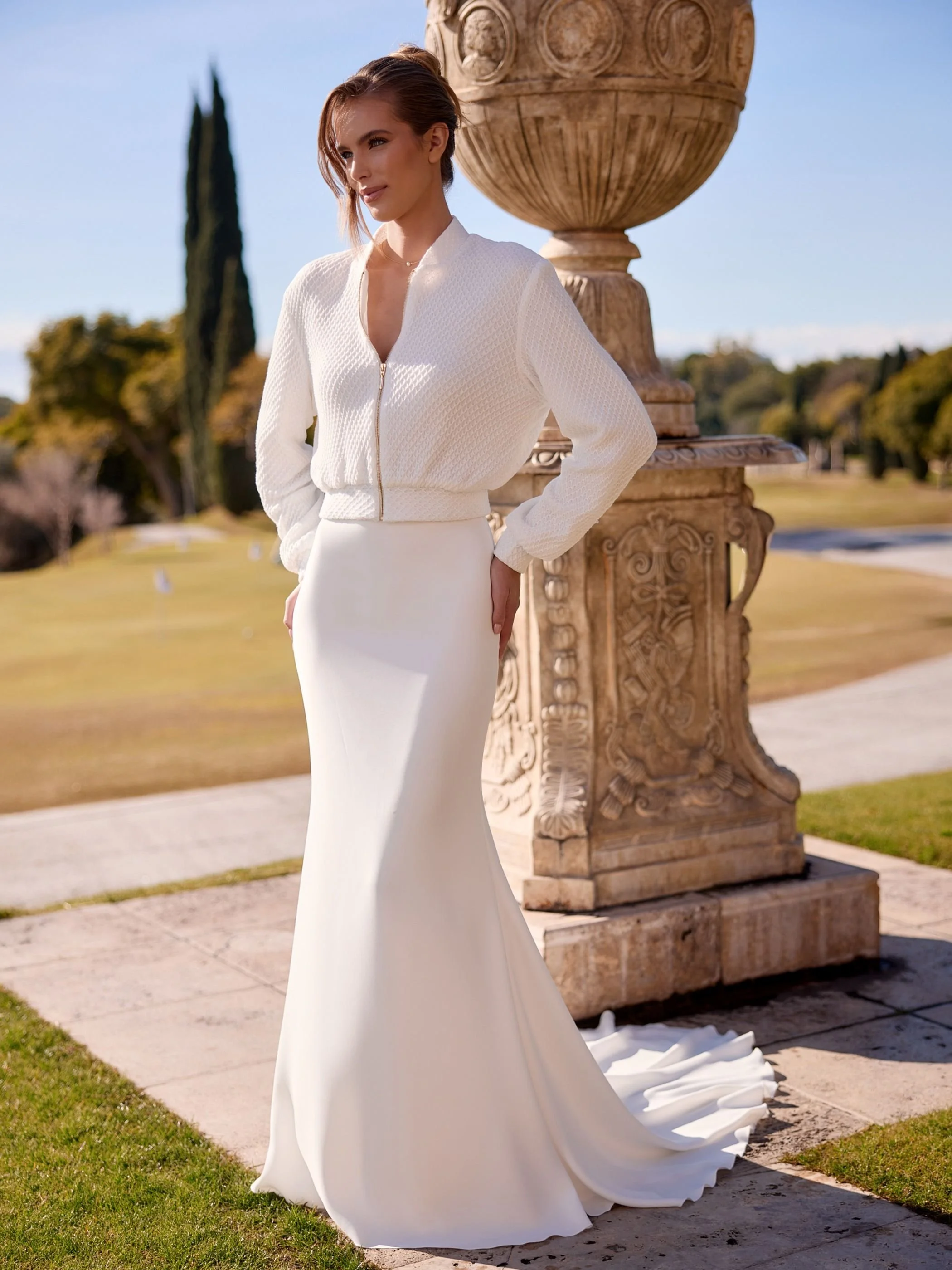Summit with bomber Discover the Summit Bridal Skirt, a luxurious stretch crepe mermaid wedding skirt featuring a flattering silhouette and elegant cathedral-length train.