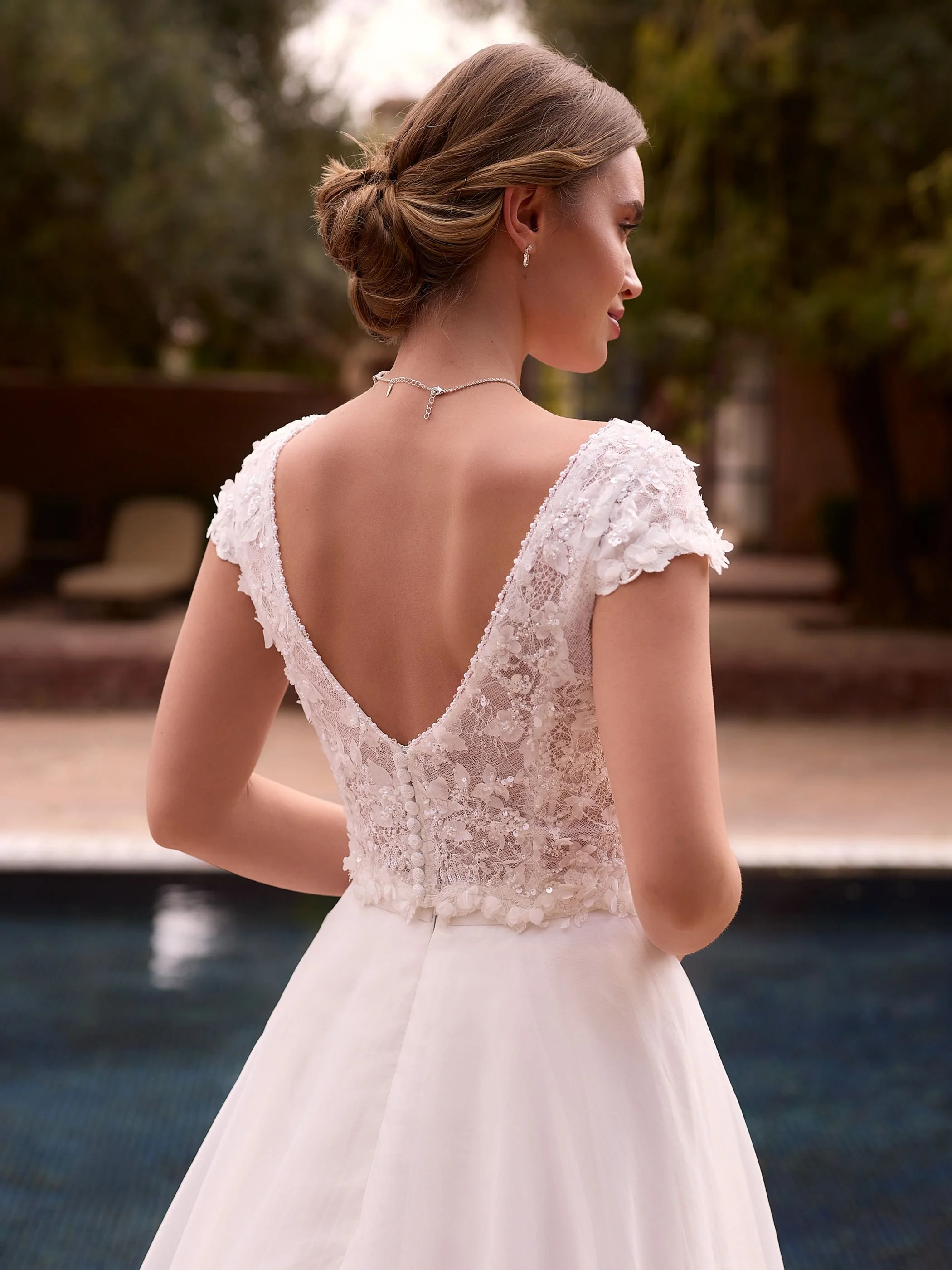 Encaptured top back view showing v back detail and beading