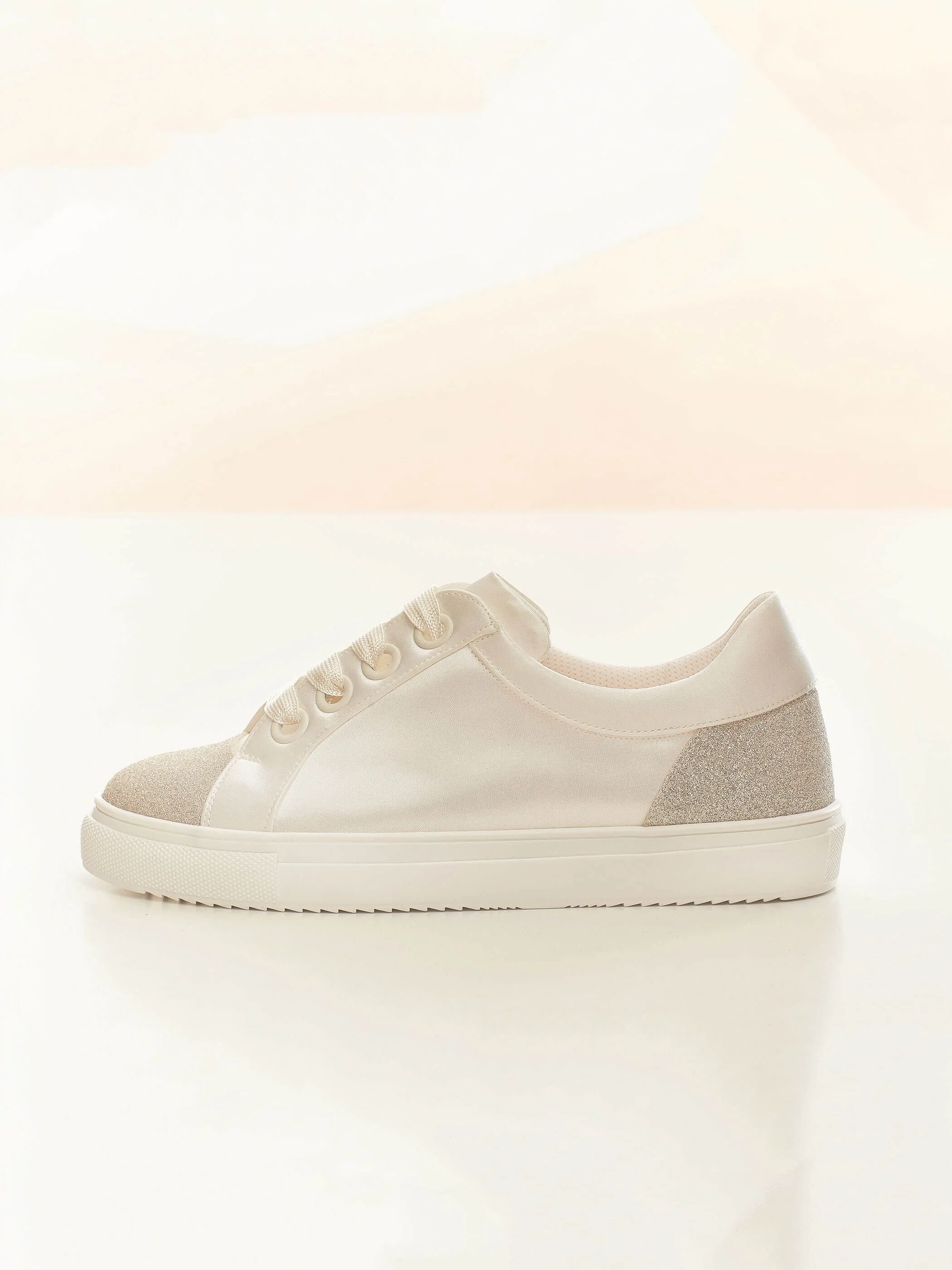 Robin side view. Ivory with shimmer panel bridal sneaker