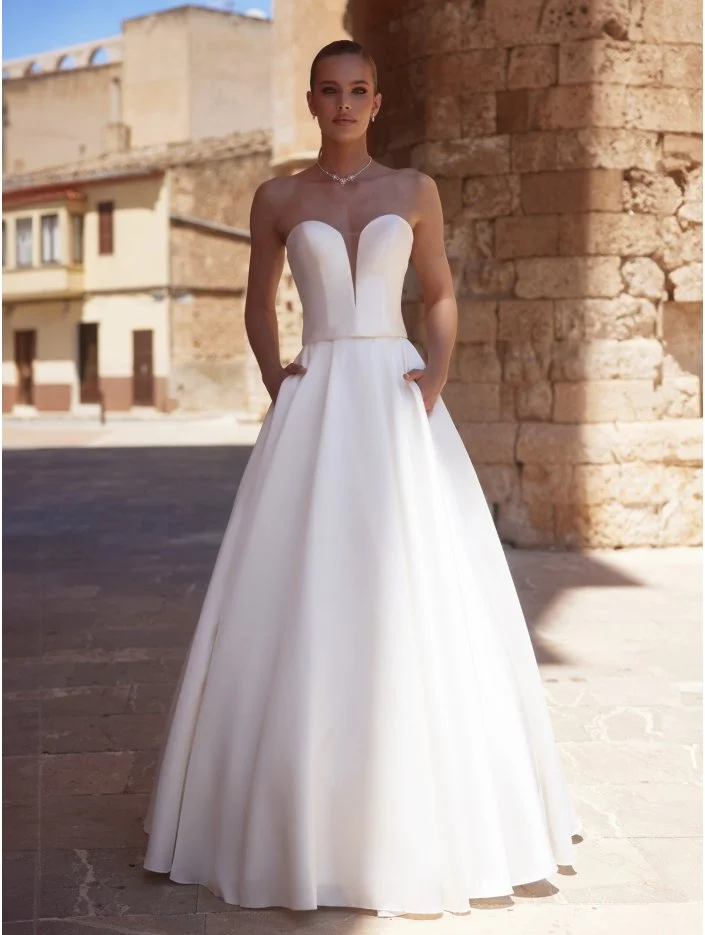 Molten with skirt bride has hand in her pockets