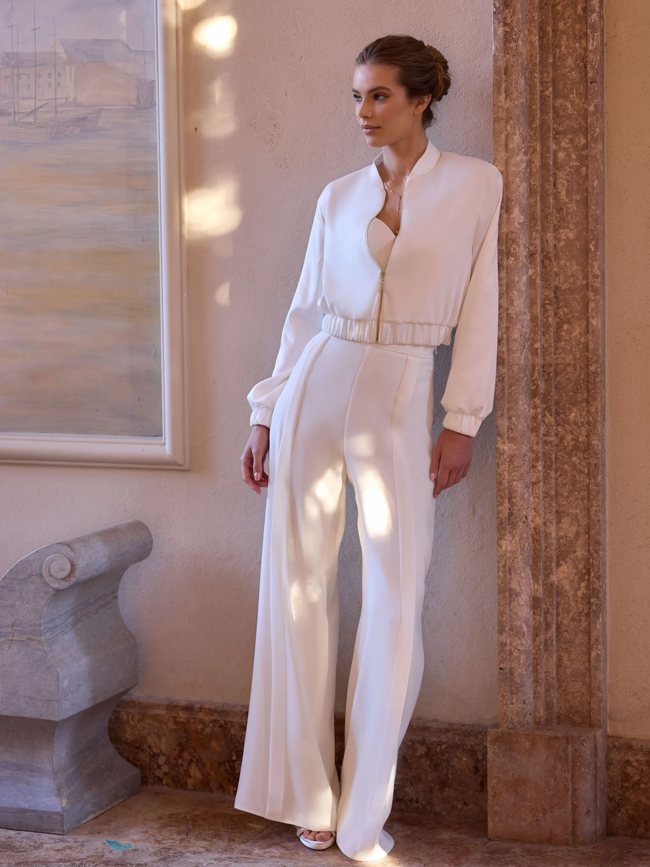 Basu bomber full length image of bride leaning on a pillar