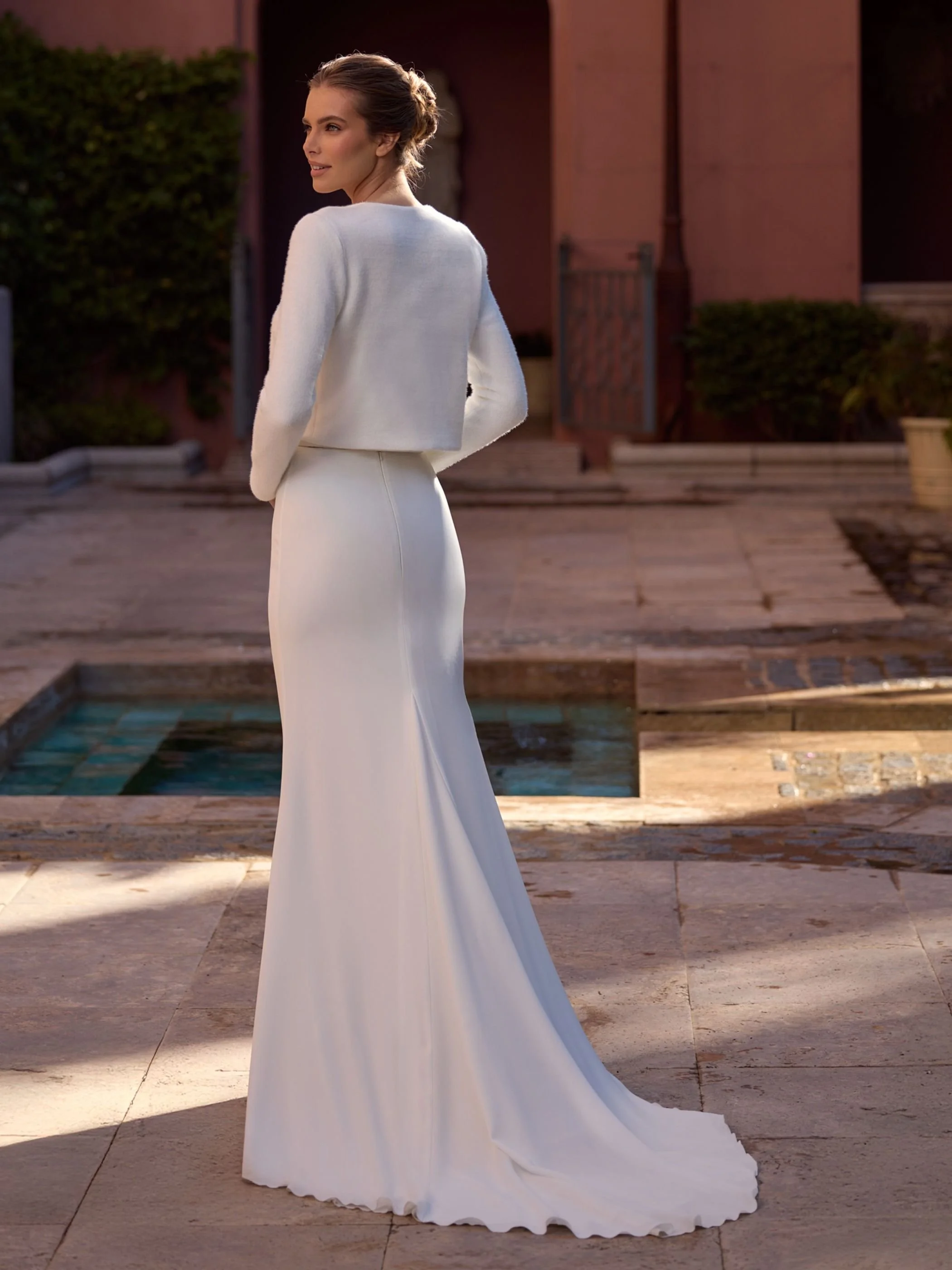 Summit with cami and cardi back view the Summit Bridal Skirt, a luxurious stretch crepe mermaid wedding skirt featuring a flattering silhouette and elegant cathedral-length train.