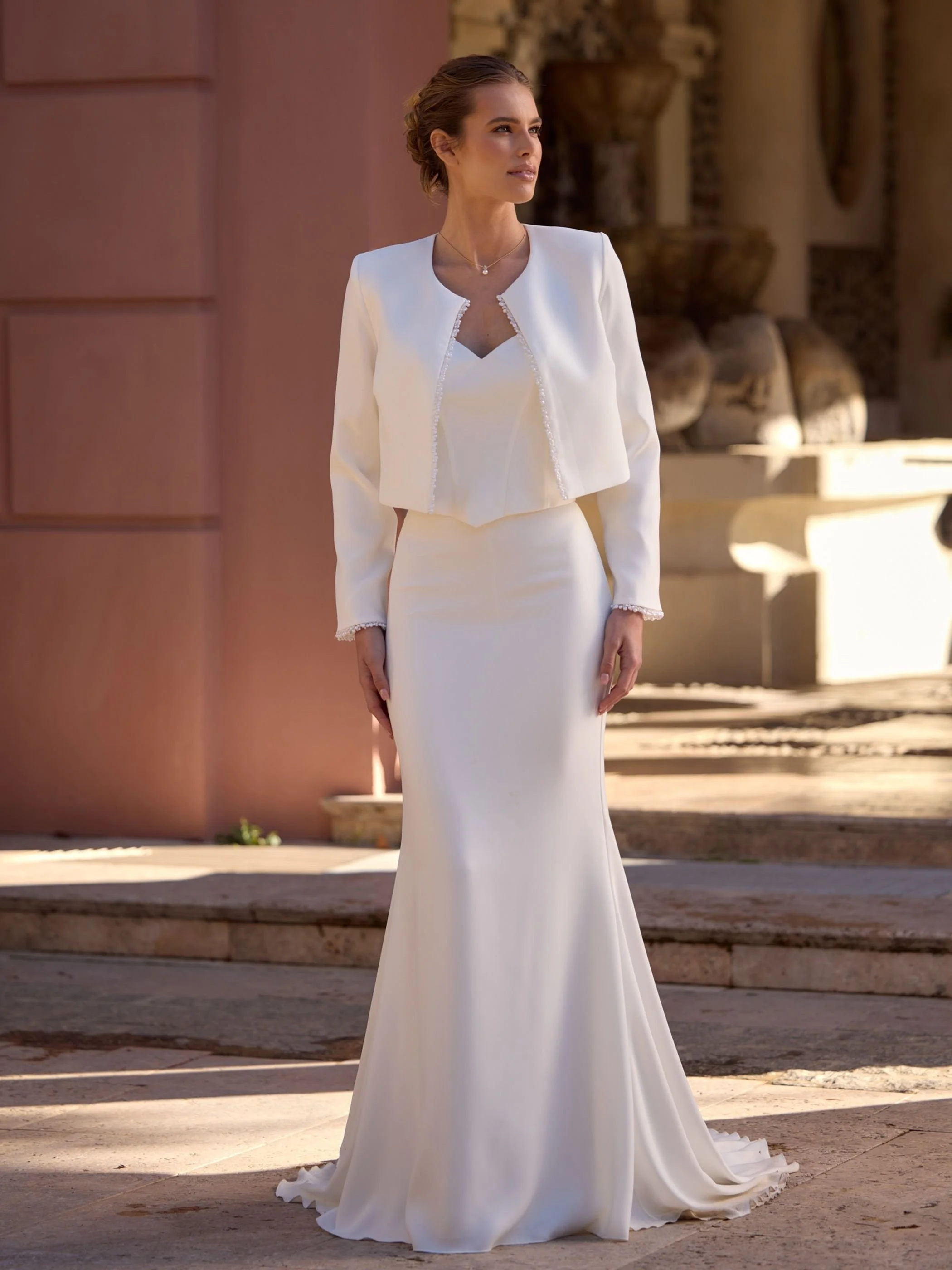 Summit with crop. Discover the Summit Bridal Skirt, a luxurious stretch crepe mermaid wedding skirt featuring a flattering silhouette and elegant cathedral-length train.