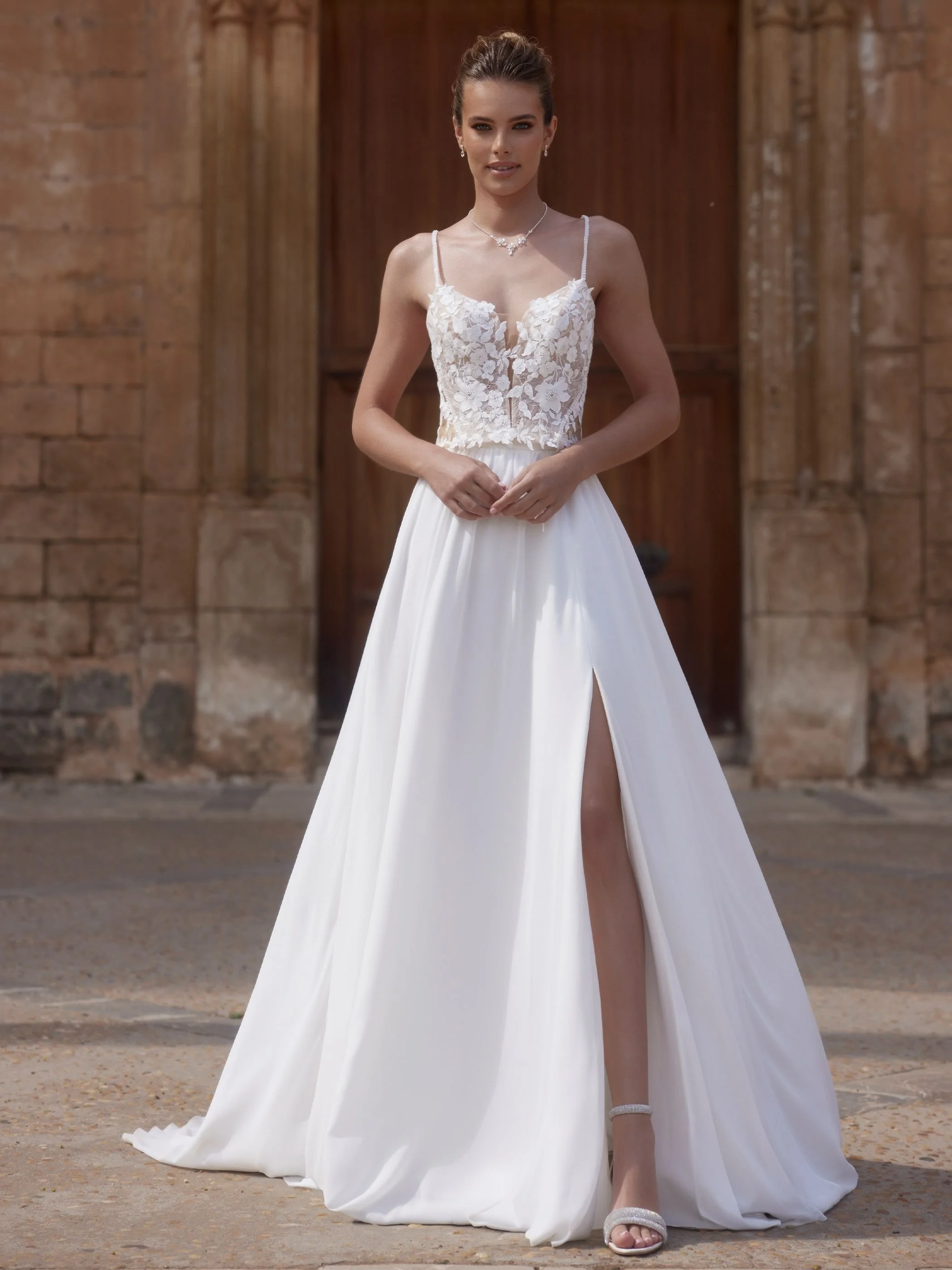 Pillar delicate lace bridal top with shoe string straps and shown with bridal skirt