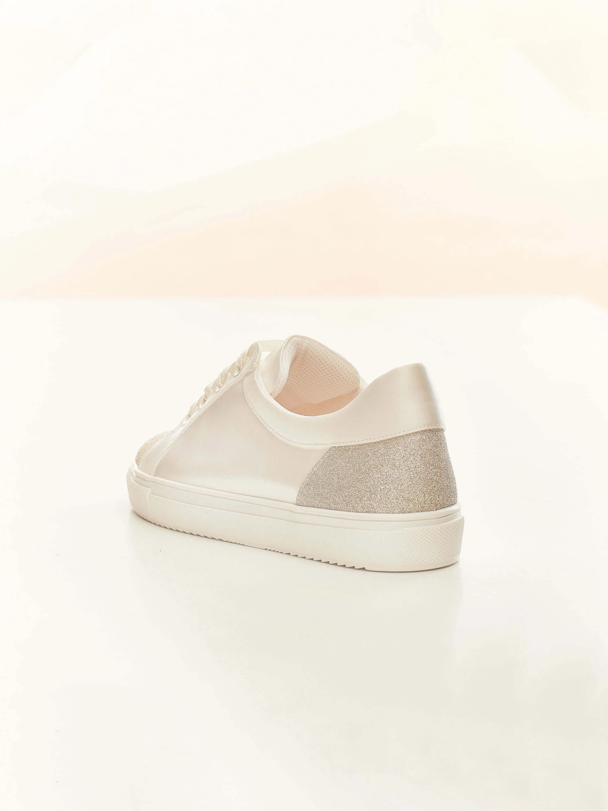 Robin back view. Ivory with shimmer panel bridal sneaker