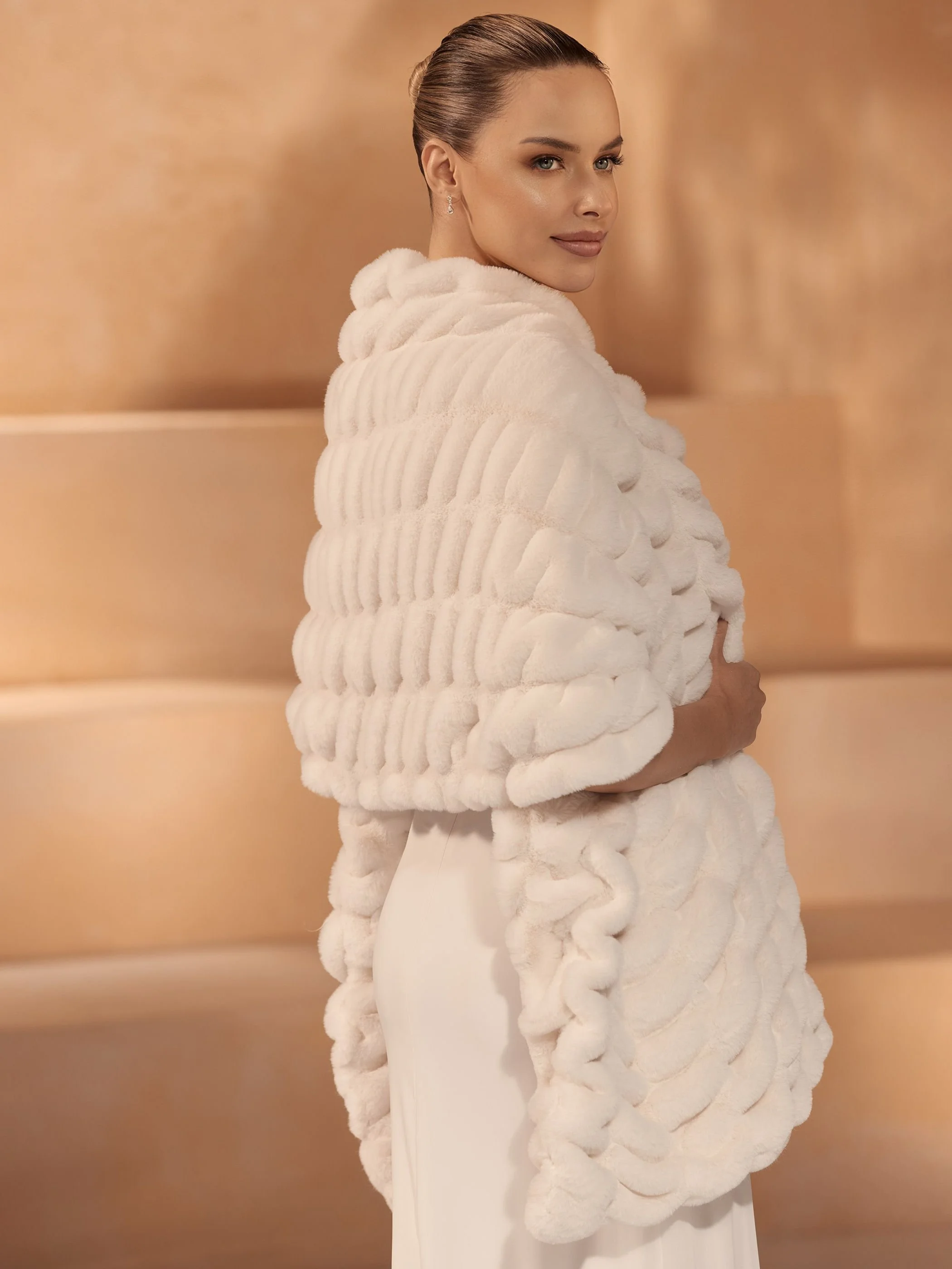 Bride snuggled in her faux fur wrap