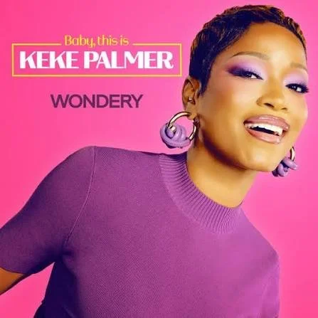 Album cover featuring Keke Palmer with purple makeup and earrings, wearing a purple top, against a pink background. Text reads 'Baby, this is Keke Palmer' and 'Wondery'.