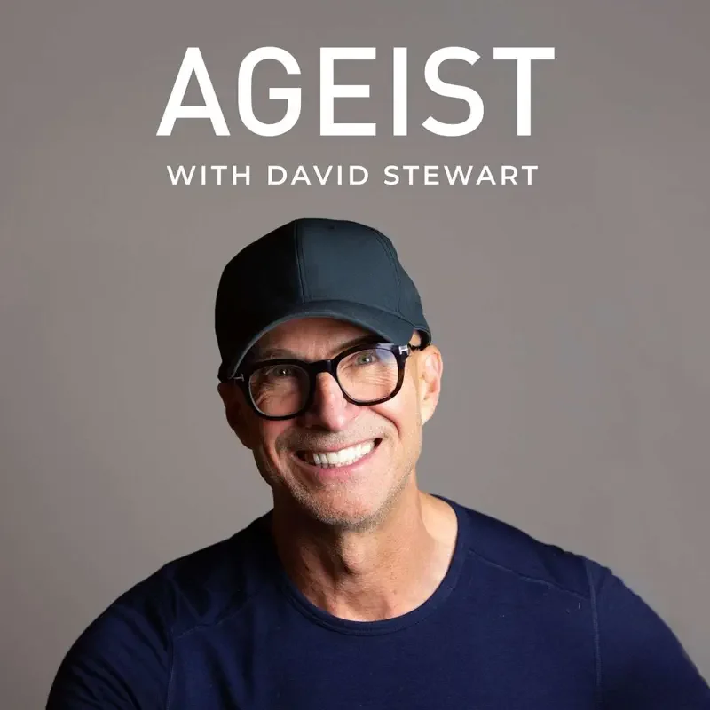 Cover image of a podcast titled "AGEIST with David Stewart" featuring a smiling man wearing glasses, a black cap, and a navy blue shirt, against a plain gray background.
