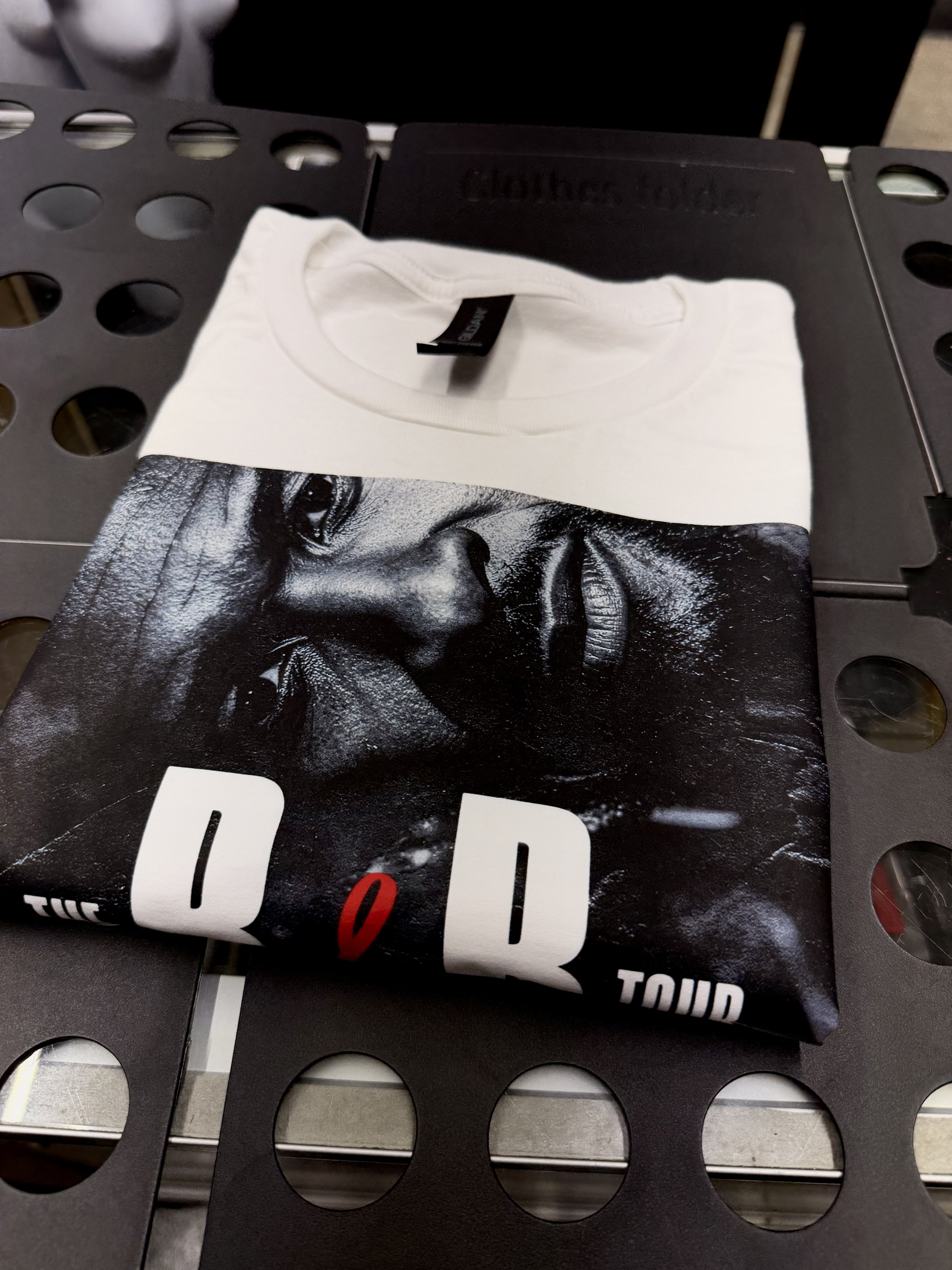 Custom concer T-shirt designed and printed for a customer featuring Usher and Chris Brown artwork, created by PurePress Wholesale. 