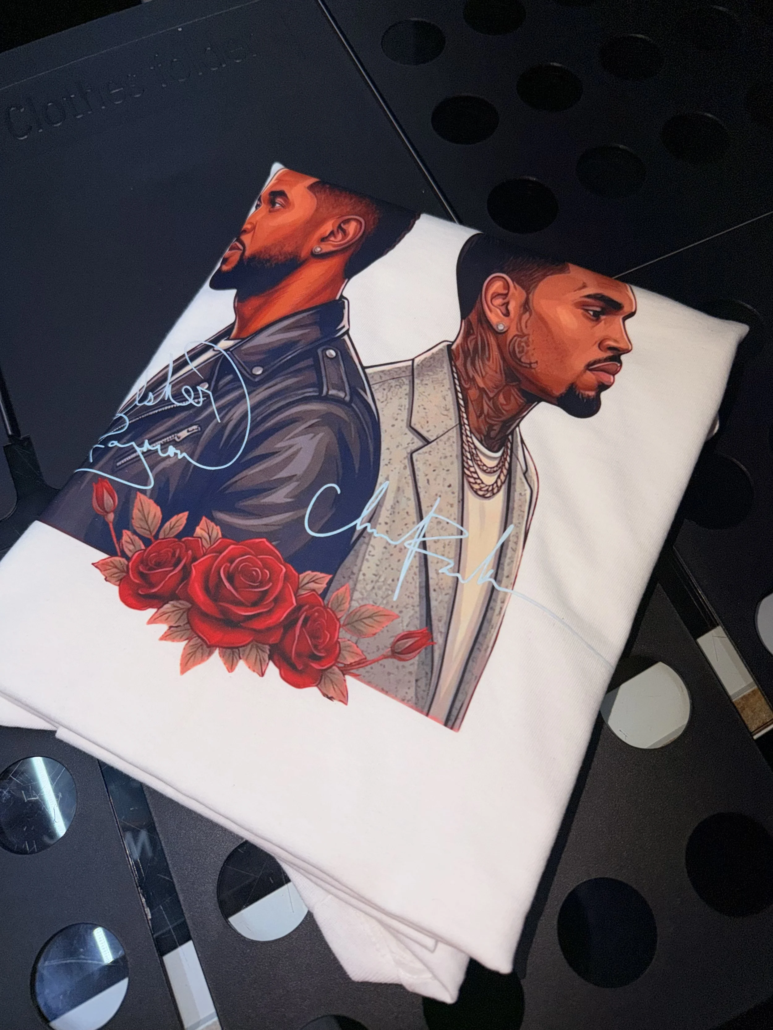 Custom concert T-shirt featuring Usher and Chris Brown, printed by PurePress Wholesale for a customer attending the concert. 