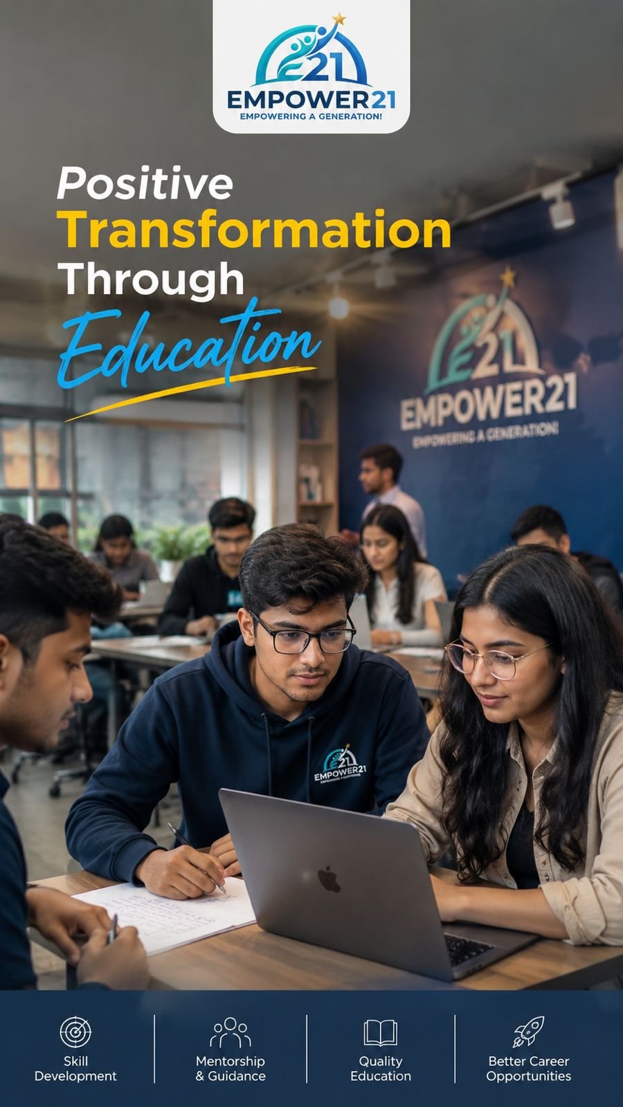Young adults at a classroom or workshop, focused on a laptop, participating in Empower21 program for education and skill development.