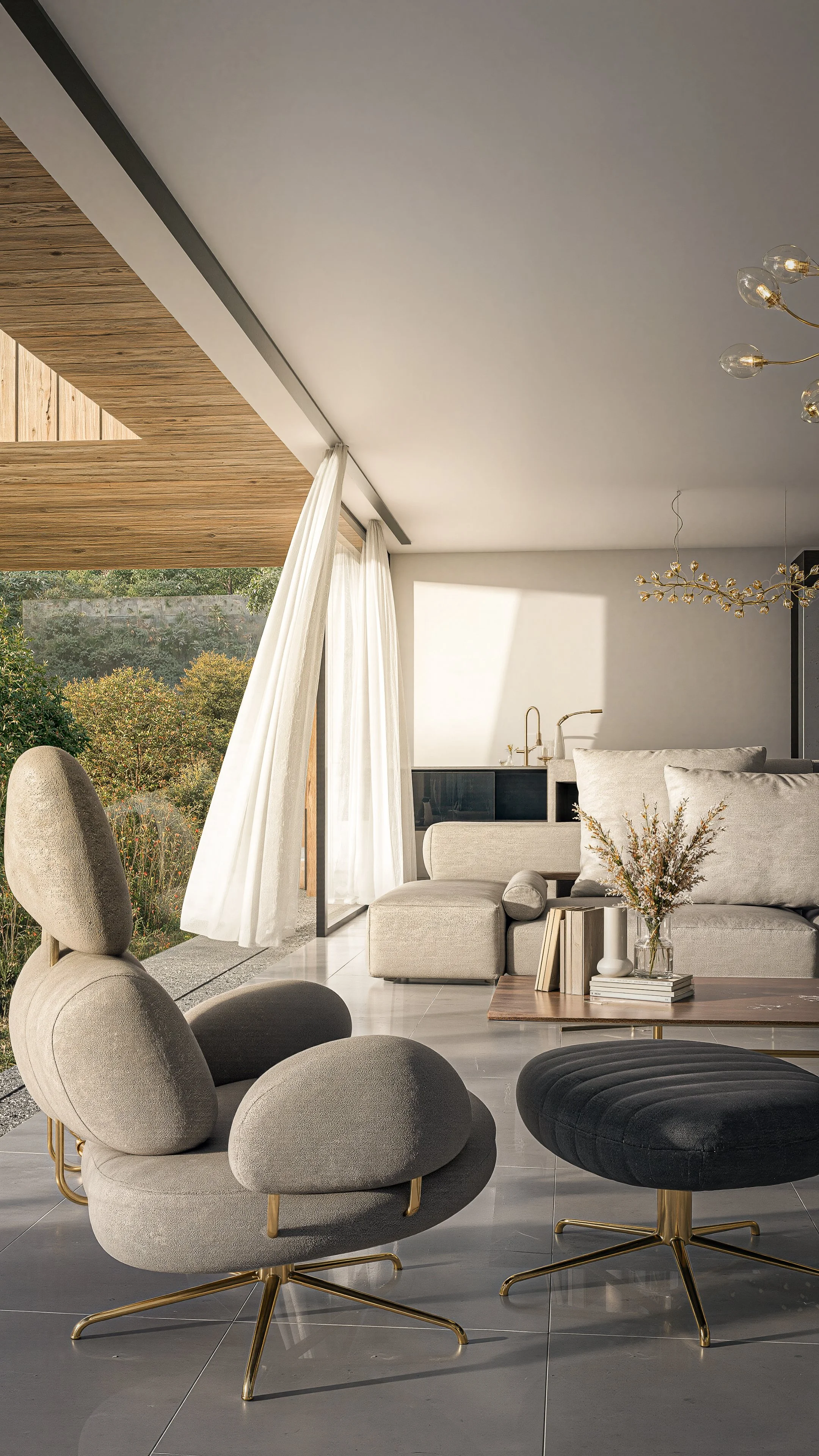 Modern living room with beige chairs and black tufted ottoman on gray tile floor, light-colored sofa, wooden coffee table with books and vase, large window with white curtains, features high ceilings, gold accents, and contemporary chandelier, with views of greenery outside.