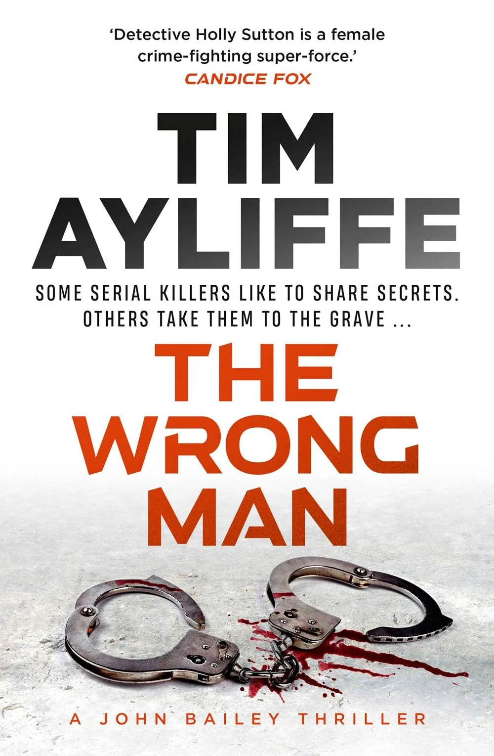 Book cover for 'The Wrong Man' by Tim Ayliffe. Features a pair of bloodstained handcuffs on a gray surface with blood splatter, against a white background.