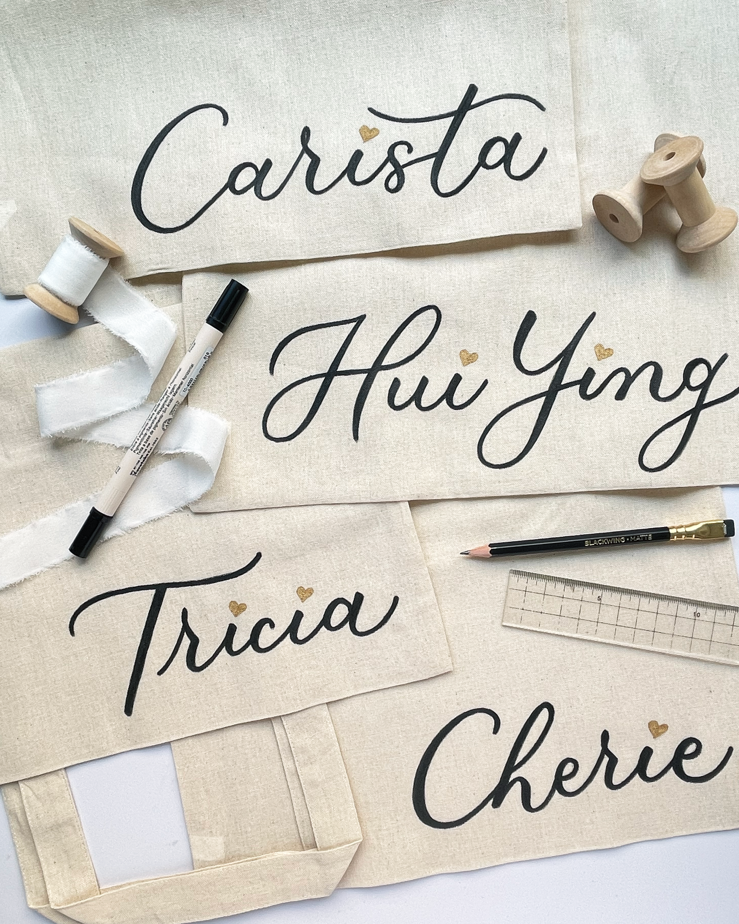 Custom Hand Lettered Personalised Tote Bags, as Client Appreciation Gifts for a Financial Advisor. Tool used: Fabric Marker.
