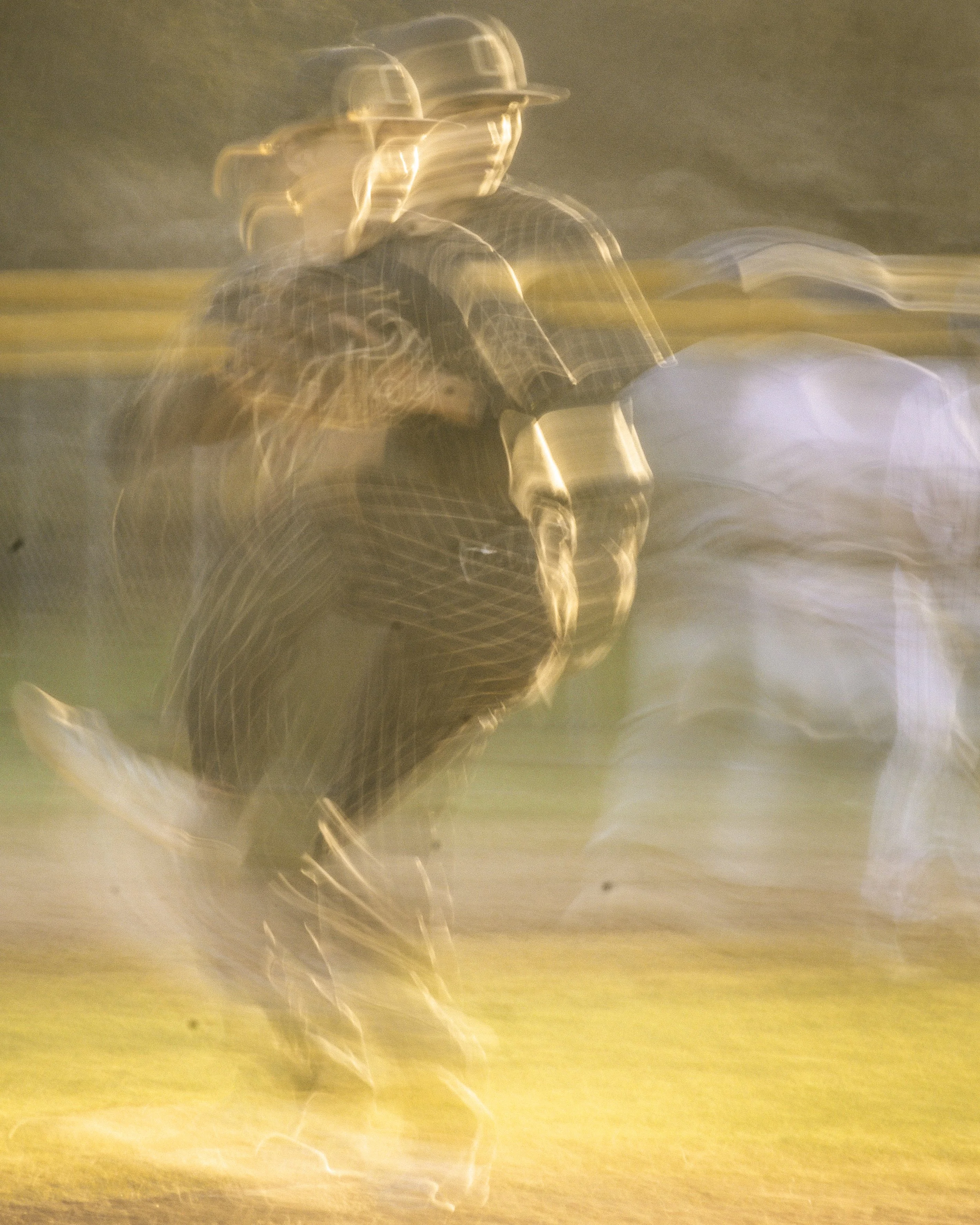 A person riding a bicycle at night, with motion blur and light trails.