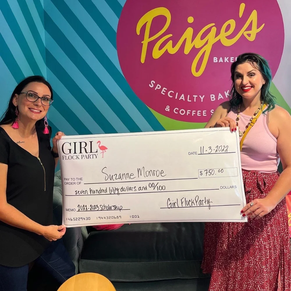 Girl Flock Party scholarship recipient receiving a check