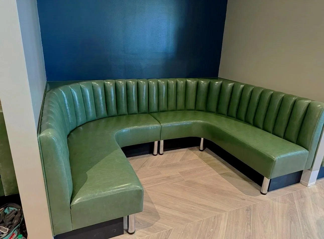 Custom upholstered bench seating with detailed stitching