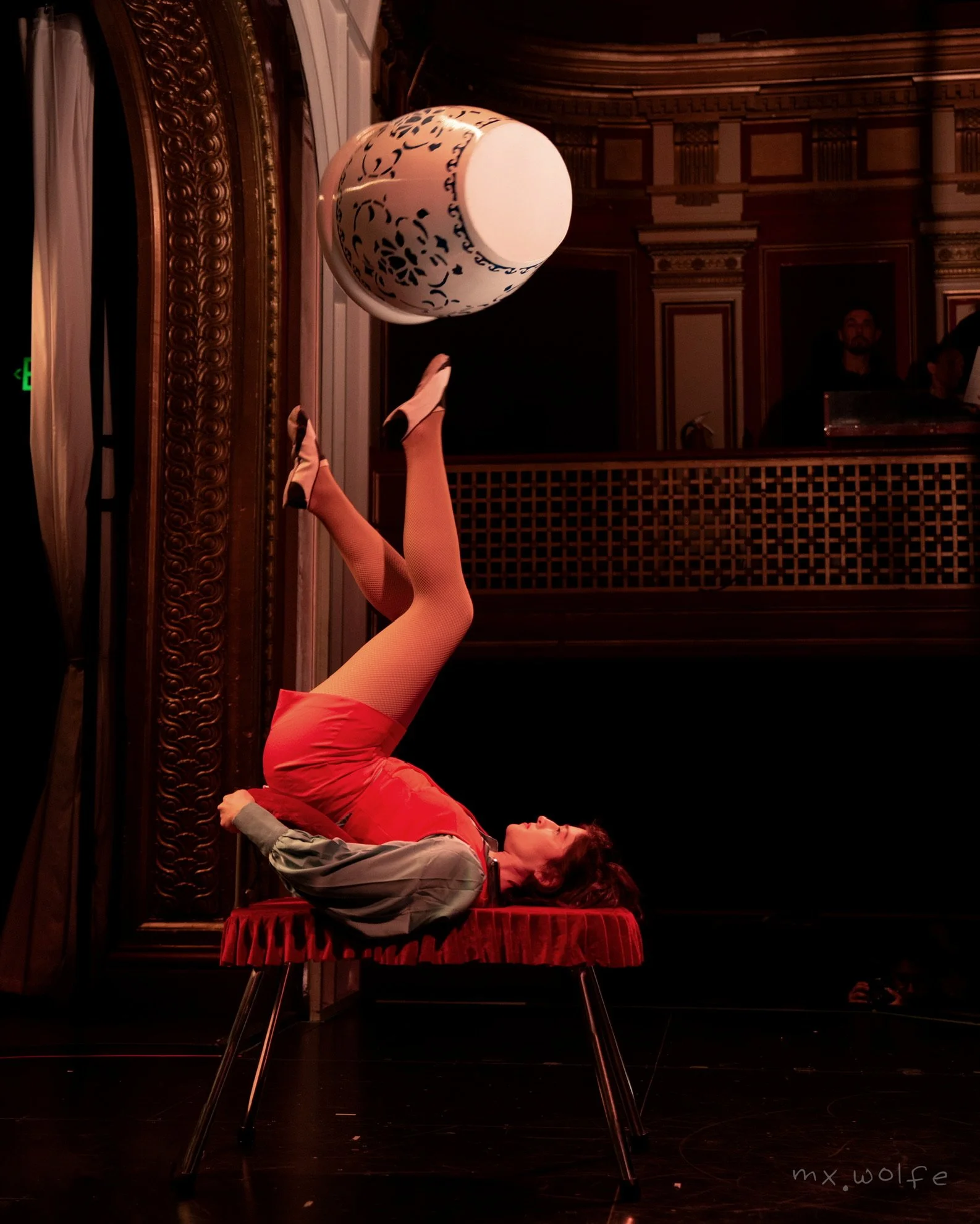 A woman foot juggling at Club Fugazi in San Francisco.