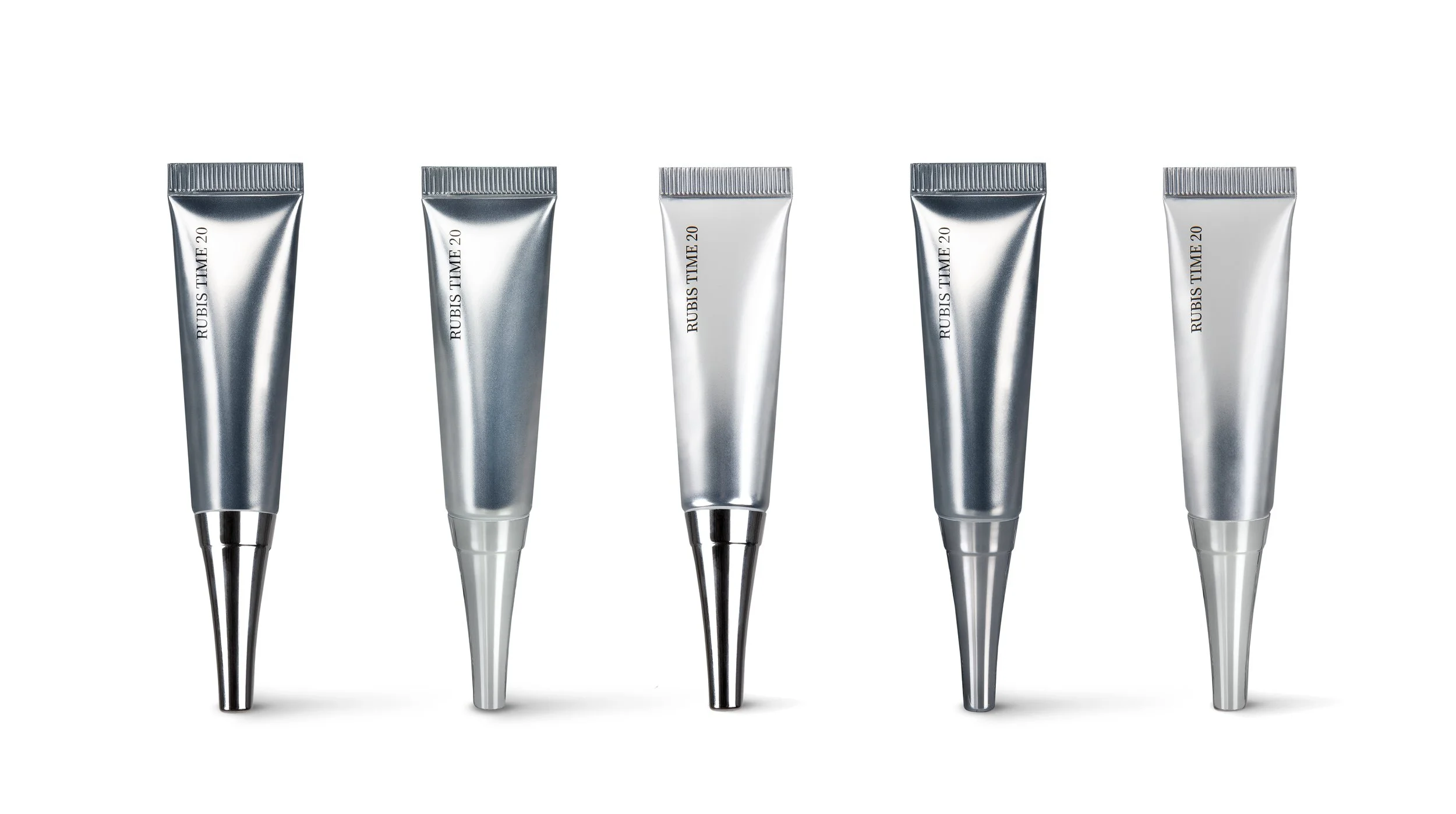 Cinq tubes de crème ou gel en aluminium, alignés en rangée, avec inscriptions 'RUBIS TIME 20' sur chaque tube, sur fond blanc.