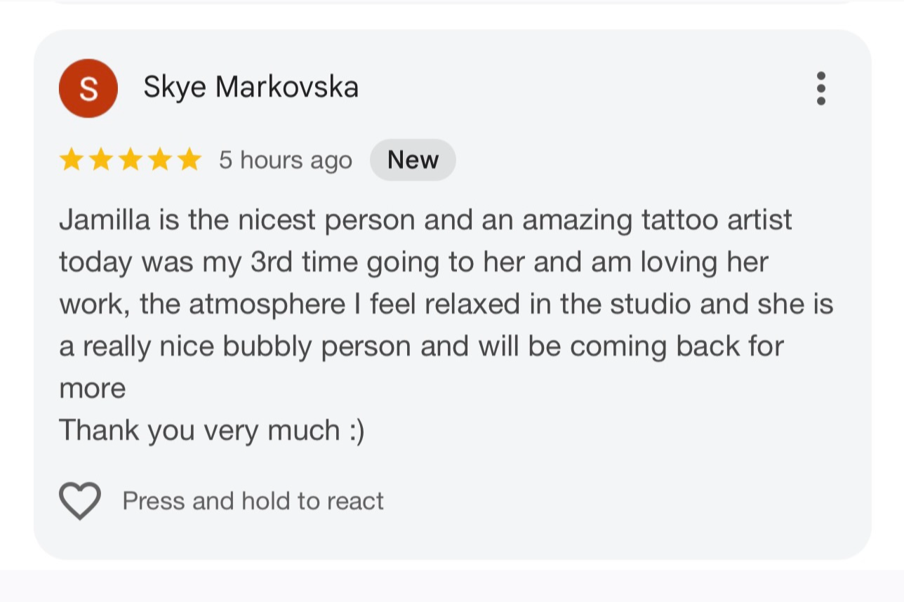 Screenshot of a Google review for Jamilla, praising her as a kind person and talented tattoo artist, mentioning her relaxed studio environment and intention to return.