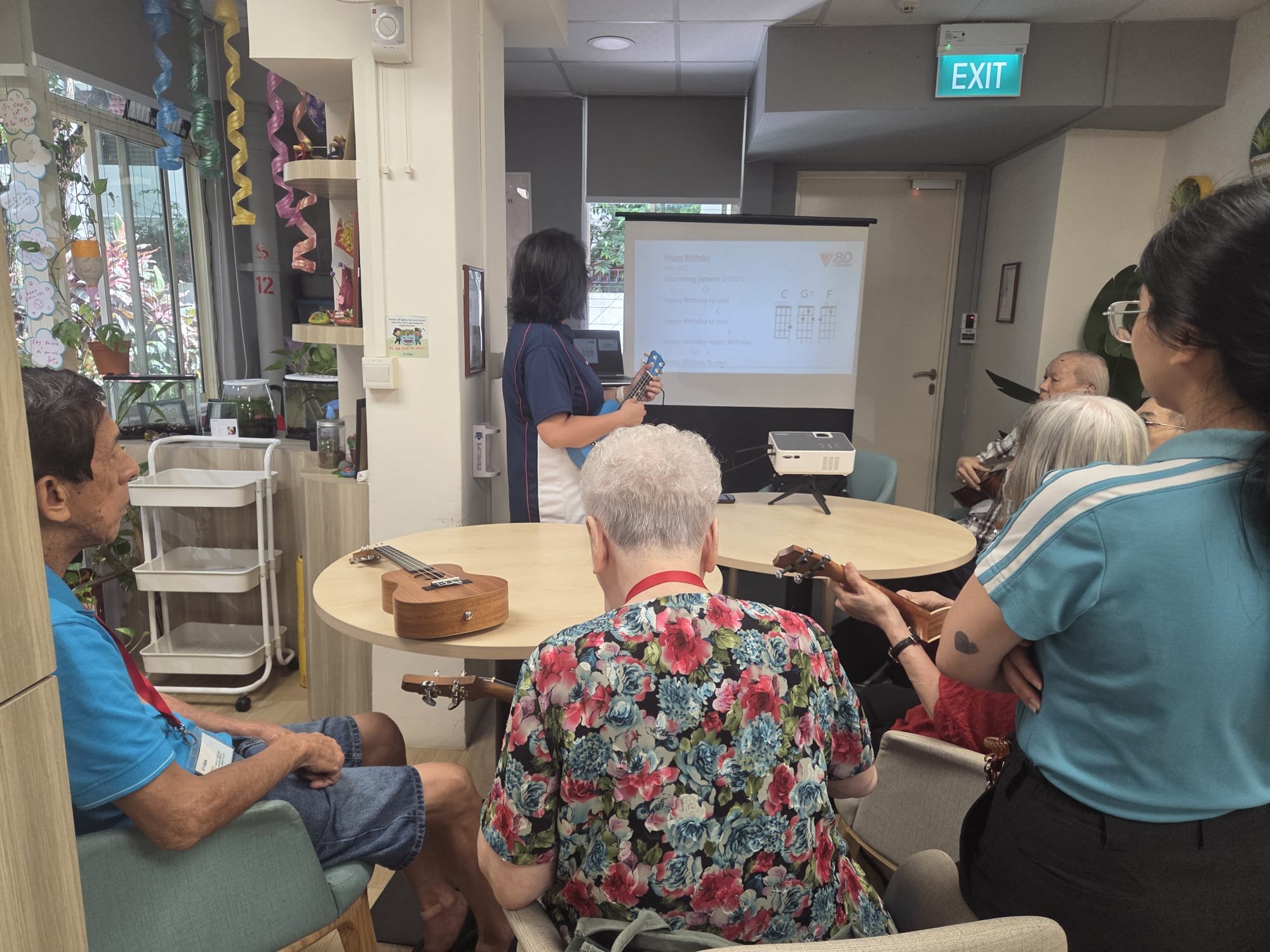 CEE Team conducting Ukulele Workshop @  NTUC Health Senior Day Care