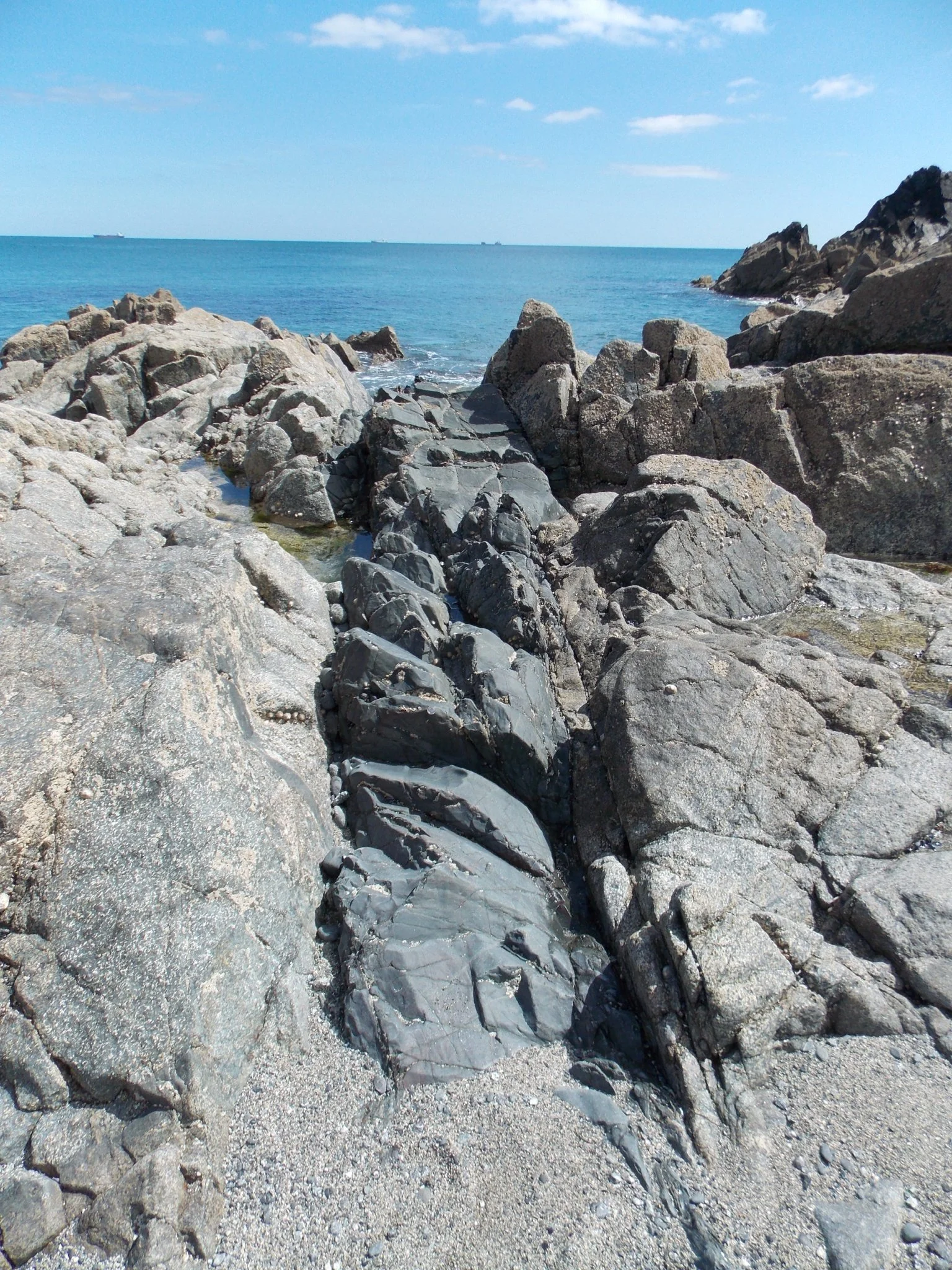 Basalt dykes cut through the gabbro at Godrevy Cove.